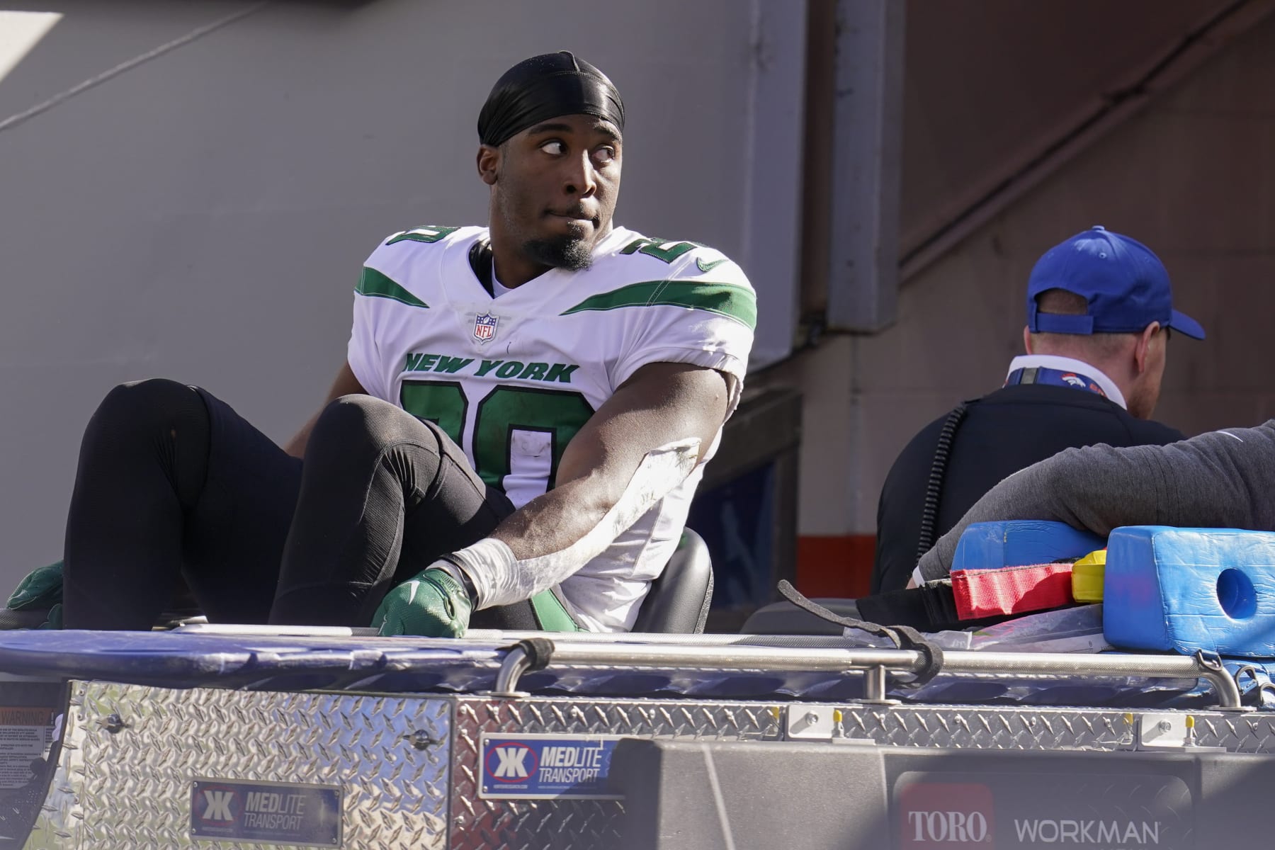 New York Jets running back Breece Hall (20) leaves the field after an injury against the Denver Broncos during the second half of an NFL football game, Sunday, Oct. 23, 2022, in Denver. (AP Photo/Matt York)
