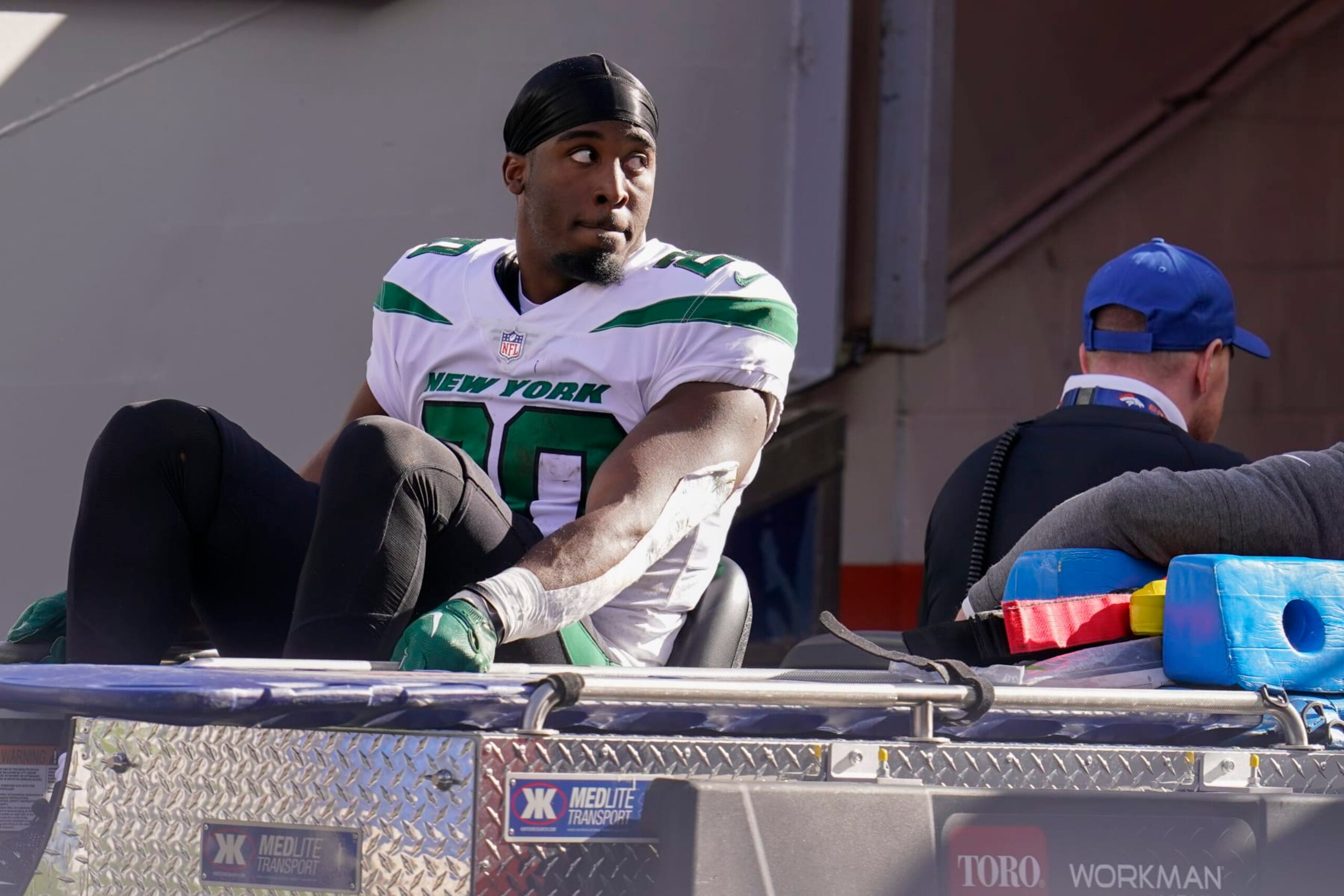 New York Jets running back Breece Hall (20) leaves the field after an injury against the Denver Broncos during the second half of an NFL football game, Sunday, Oct. 23, 2022, in Denver. (AP Photo/Matt York)