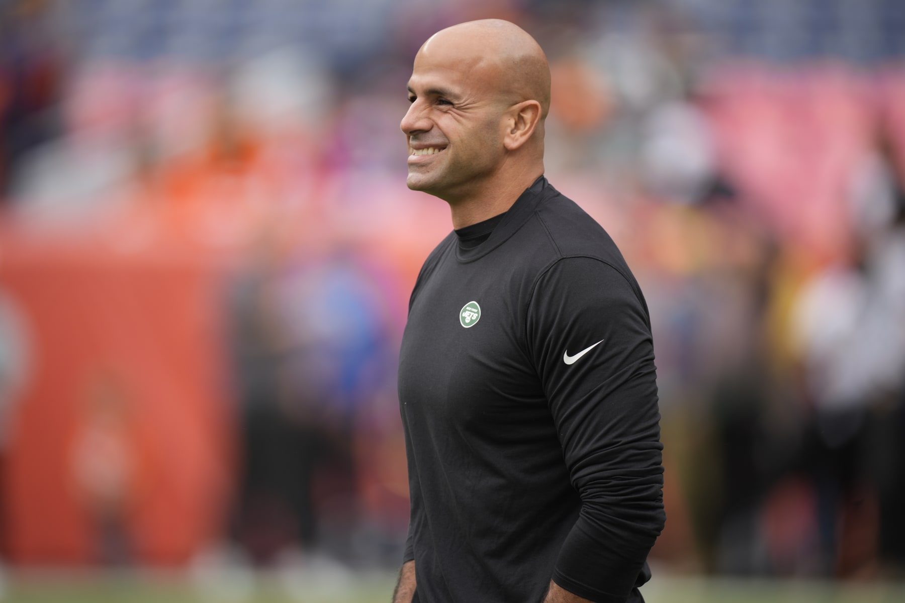 New York Jets head coach Robert Saleh walks the turf ahead of an NFL football game between the Denver Broncos and the New York Jets, Sunday, Oct. 23, 2022, in Denver. (AP Photo/David Zalubowski)