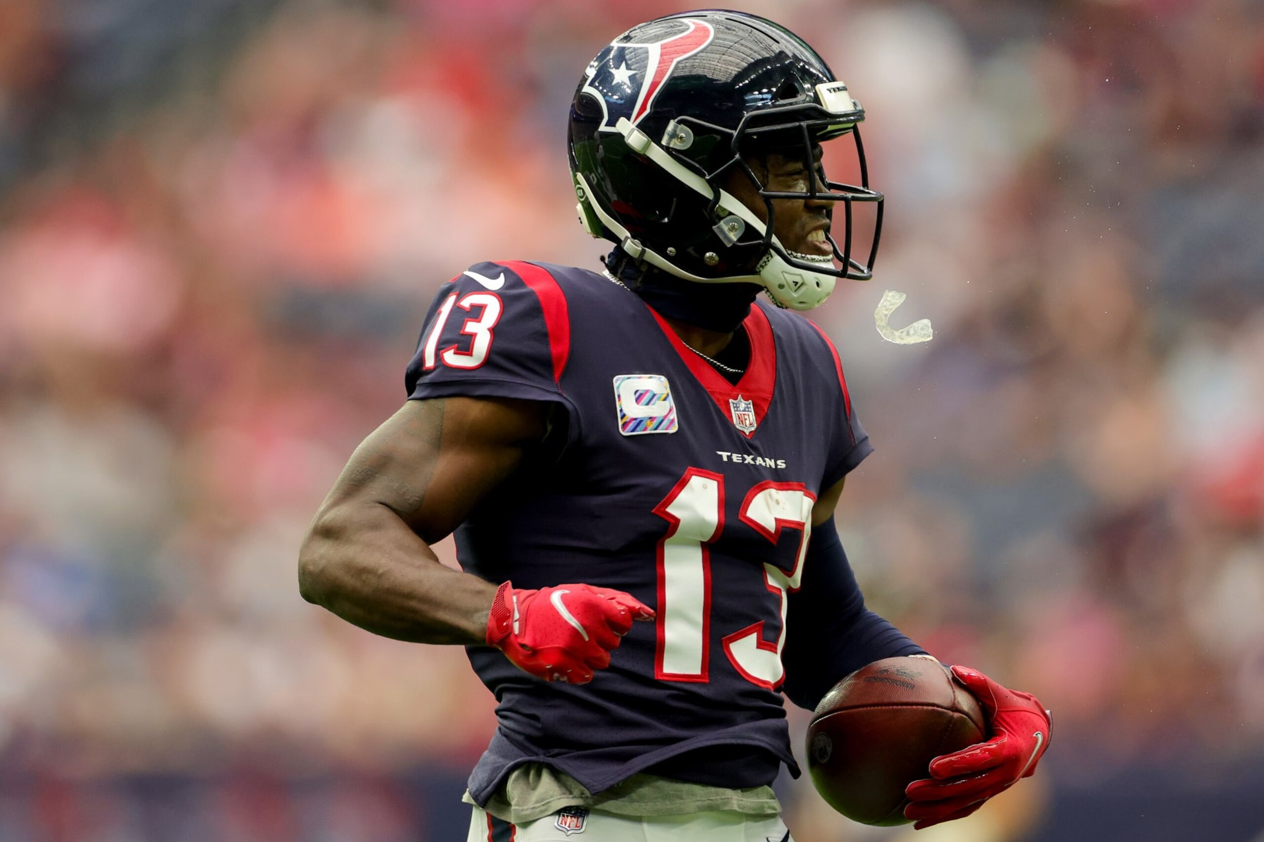 HOUSTON, TEXAS - OCTOBER 02: Brandin Cooks #13 of the Houston Texans reacts after making a catch in the first quarter against the Los Angeles Chargers at NRG Stadium on October 02, 2022 in Houston, Texas. (Photo by Carmen Mandato/Getty Images)
