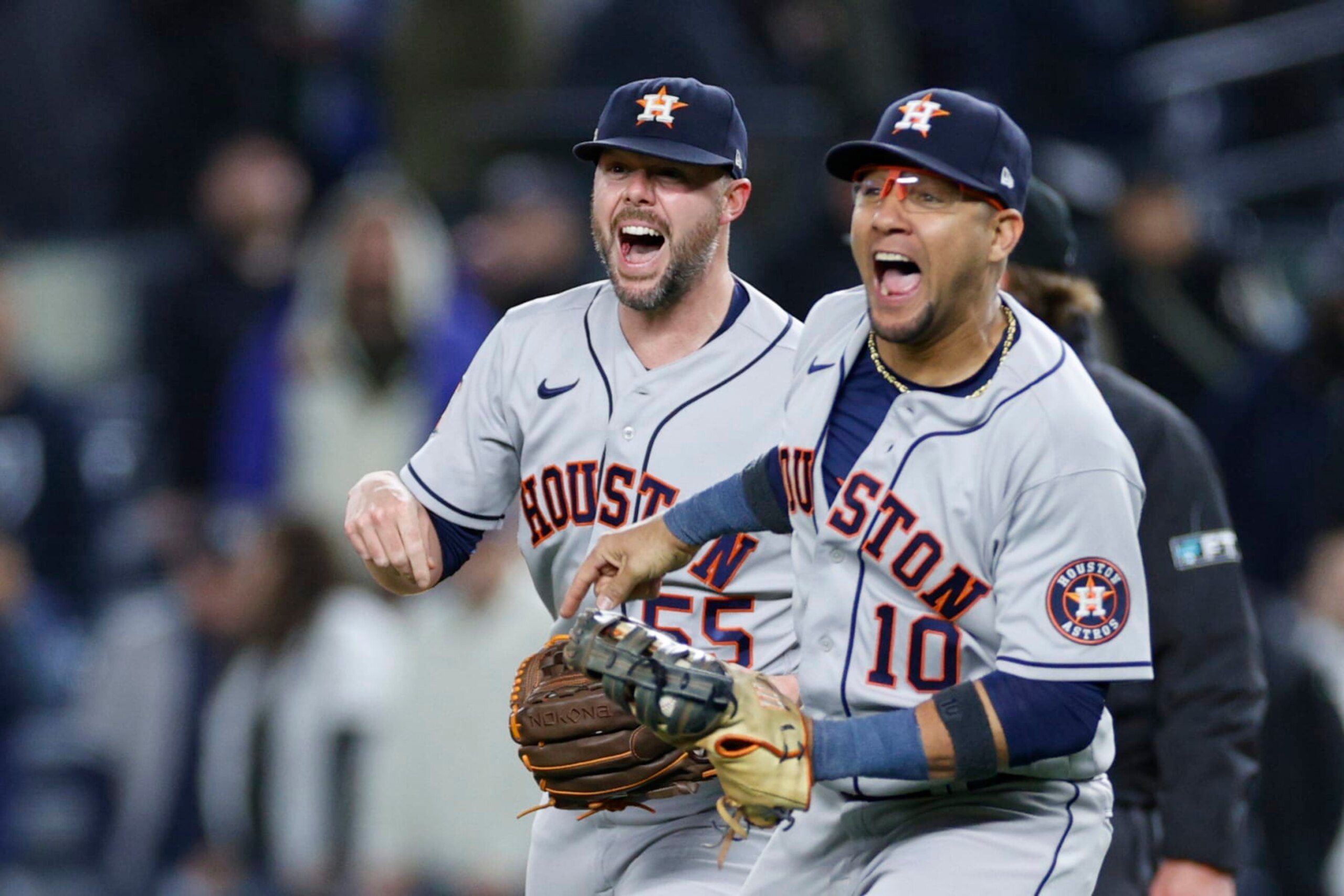 NEW YORK, NEW YORK - OCTOBER 23: Yuli Gurriel #10, and Ryan Pressly #55 of the Houston Astros celebrate defeating the New York Yankees in game four of the American League Championship Series to advance to the World Series at Yankee Stadium on October 23, 2022 in the Bronx borough of New York City. (Photo by Sarah Stier/Getty Images)