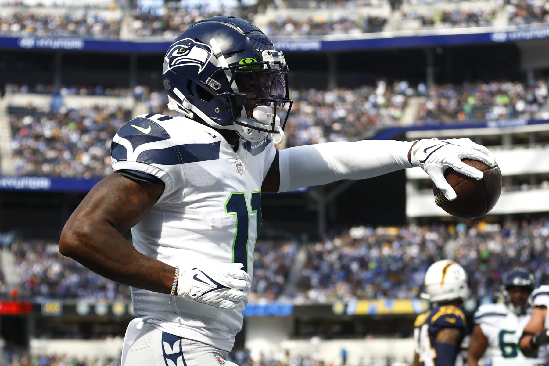 INGLEWOOD, CALIFORNIA - OCTOBER 23: Marquise Goodwin (11) of the Seattle Seahawks celebrates scoring a touchdown in the second half against the Los Angeles Chargers at SoFi Stadium on October 23, 2022 in Inglewood, California. (Photo by Ronald Martinez/Getty Images)