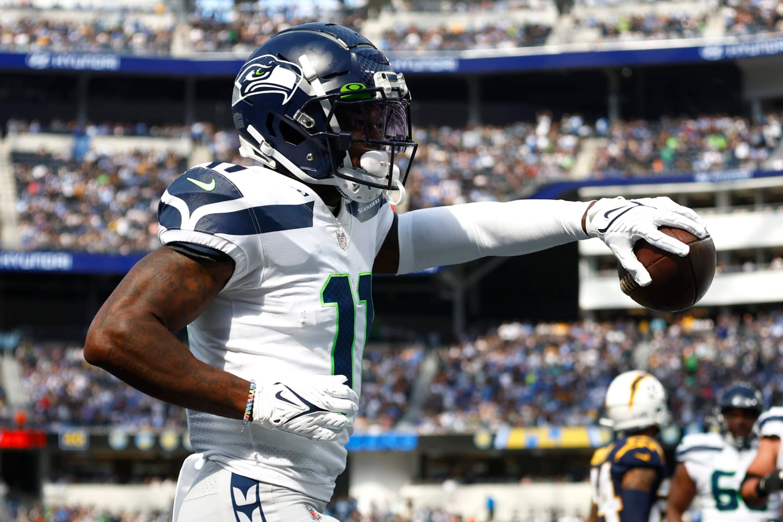 INGLEWOOD, CALIFORNIA - OCTOBER 23: Marquise Goodwin (11) of the Seattle Seahawks celebrates scoring a touchdown in the second half against the Los Angeles Chargers at SoFi Stadium on October 23, 2022 in Inglewood, California. (Photo by Ronald Martinez/Getty Images)