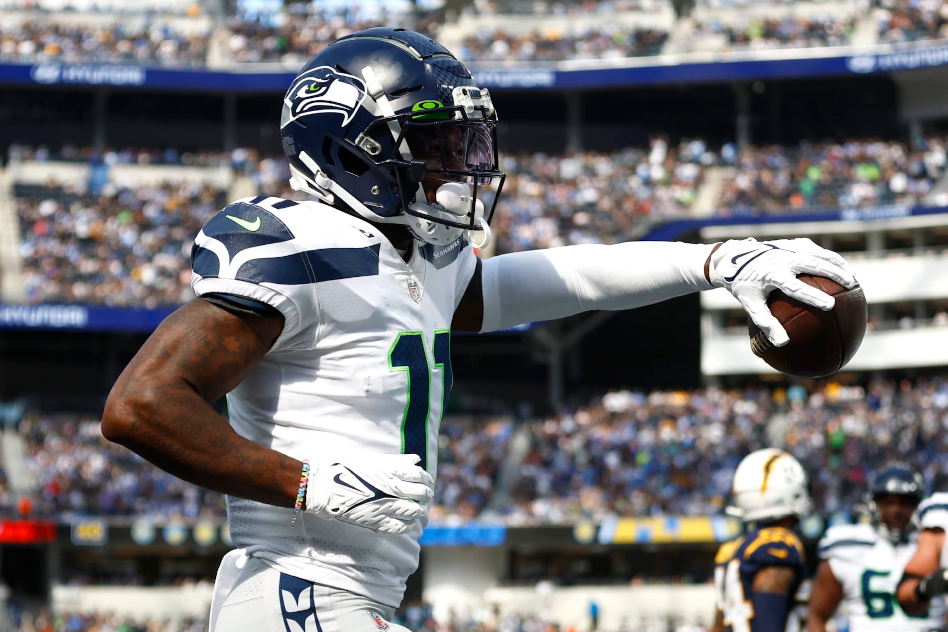 INGLEWOOD, CALIFORNIA - OCTOBER 23: Marquise Goodwin (11) of the Seattle Seahawks celebrates scoring a touchdown in the second half against the Los Angeles Chargers at SoFi Stadium on October 23, 2022 in Inglewood, California. (Photo by Ronald Martinez/Getty Images)