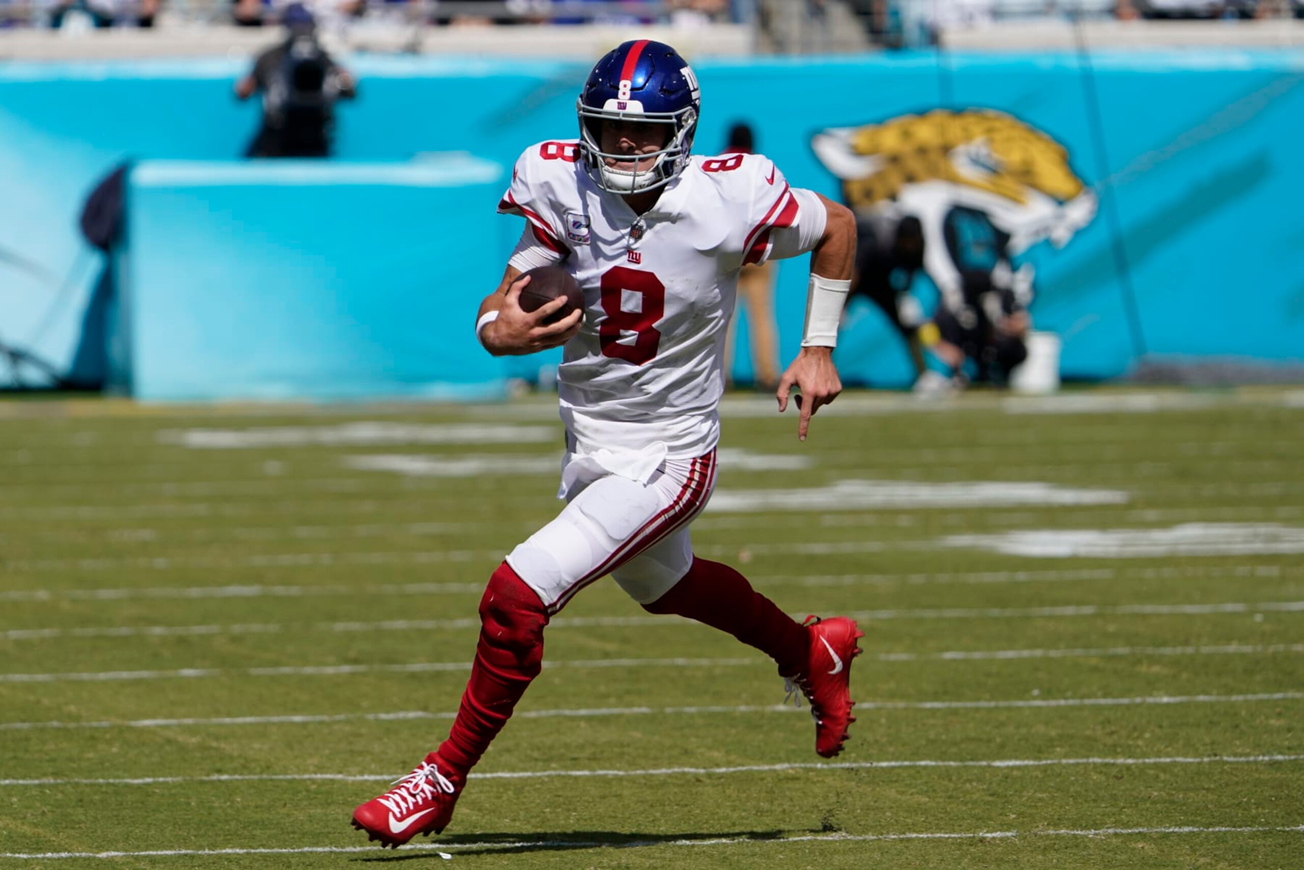 New York Giants quarterback Daniel Jones (8) runs against the Jacksonville Jaguars during the first half of an NFL football game Sunday, Oct. 23, 2022, in Jacksonville, Fla. (AP Photo/John Raoux)