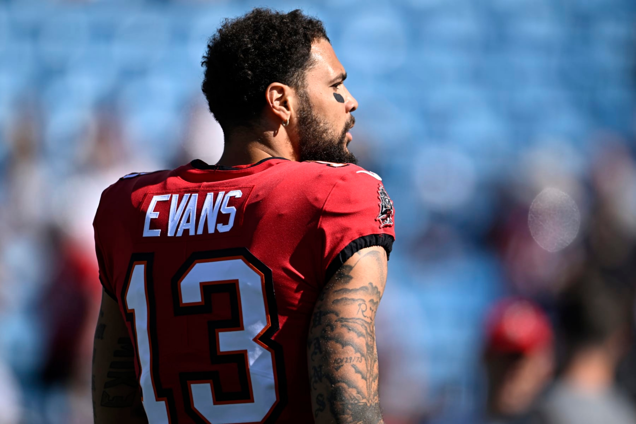 CHARLOTTE, NORTH CAROLINA - OCTOBER 23: Mike Evans #13 of the Tampa Bay Buccaneers walks onto the field durign warm ups prior to the game against the Carolina Panthers at Bank of America Stadium on October 23, 2022 in Charlotte, North Carolina. (Photo by Eakin Howard/Getty Images)