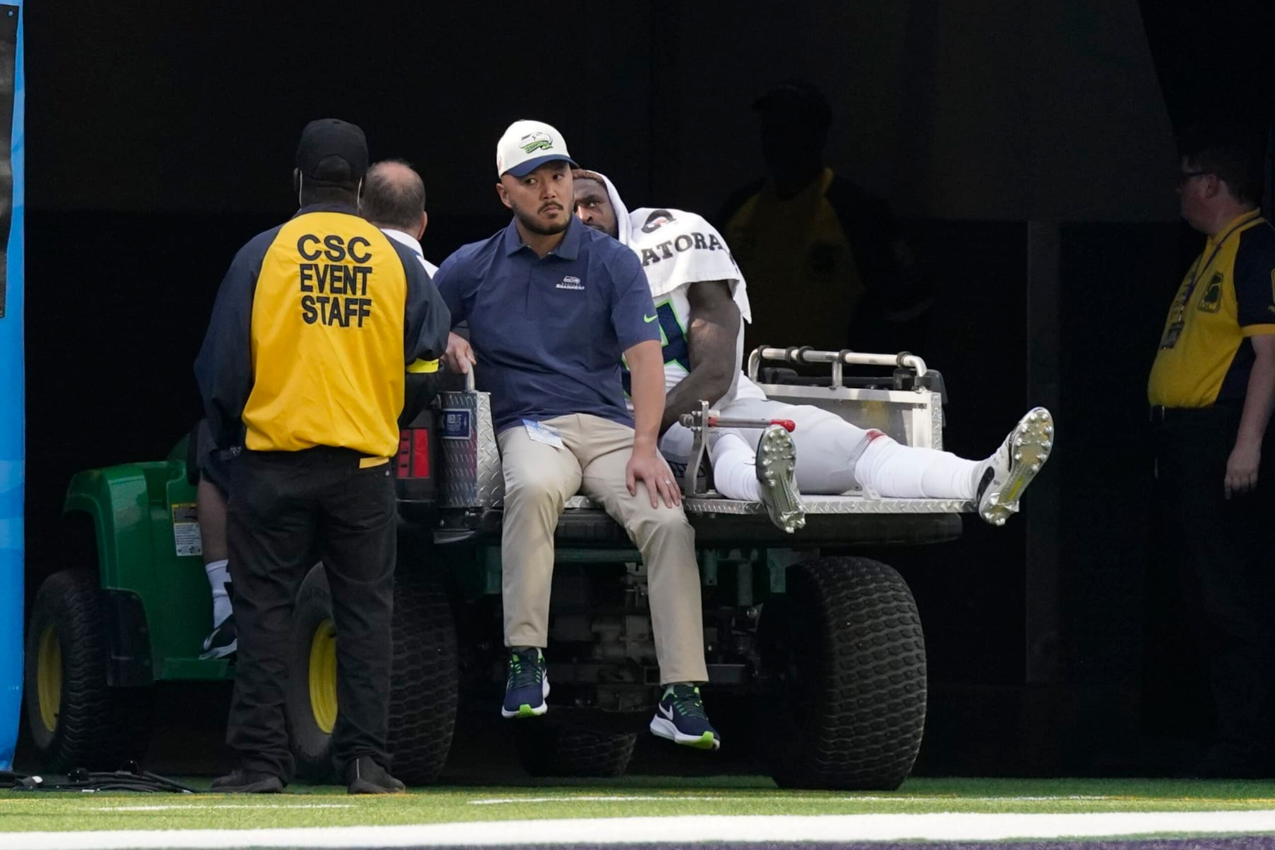 Seattle Seahawks wide receiver DK Metcalf (14) leaves the field with an injury during the first half of an NFL football game against the Los Angeles Chargers Sunday, Oct. 23, 2022, in Inglewood, Calif. (AP Photo/Mark J. Terrill)