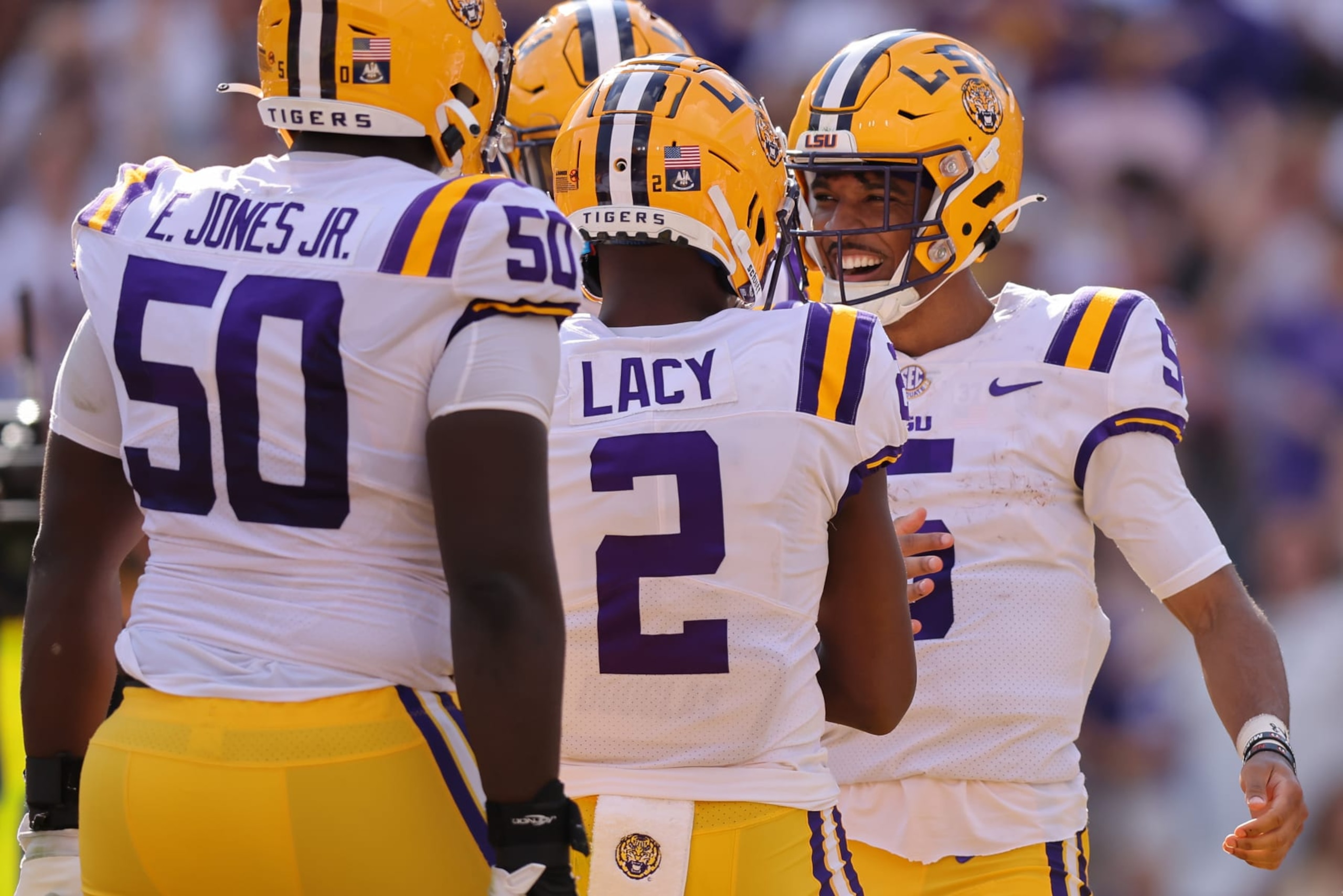 BATON ROUGE, LOUISIANA - OCTOBER 22: Jayden Daniels #5 of the LSU Tigers celebrates a touchdown during the first half against the Mississippi Rebels at Tiger Stadium on October 22, 2022 in Baton Rouge, Louisiana. (Photo by Jonathan Bachman/Getty Images)