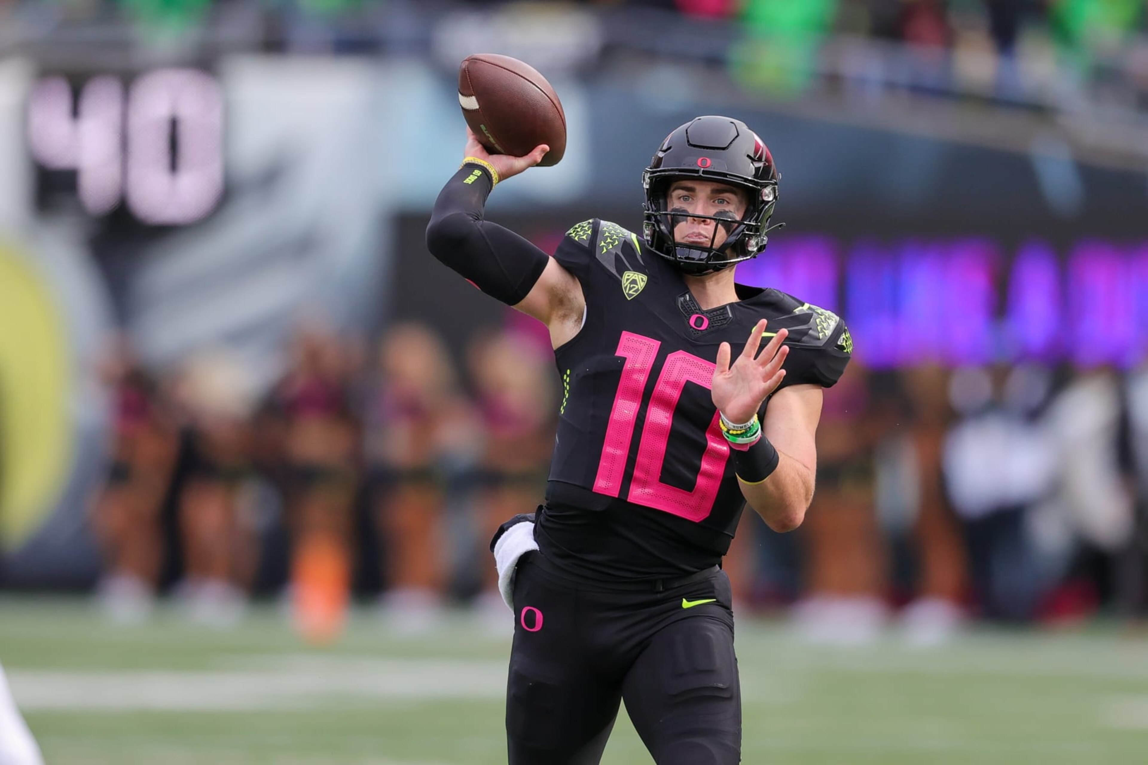 EUGENE, OR - OCTOBER 22: Oregon Ducks quarterback Bo Nix (10) throws the ball against the UCLA Bruins defense during the second half of a college football game between the Oregon Ducks and UCLA Bruins on October 22, 2022 at Autzen Stadium in Eugene, OR. (Photo by Steve Conner/Icon Sportswire via Getty Images) EUGENE, OR - OCTOBER 22: Oregon Ducks quarterback Bo Nix (10) throws the ball against the UCLA Bruins defense during the second half of a college football game between the Oregon Ducks and UCLA Bruins on October 22, 2022 at Autzen Stadium in Eugene, OR. (Photo by Steve Conner/Icon Sportswire via Getty Images)