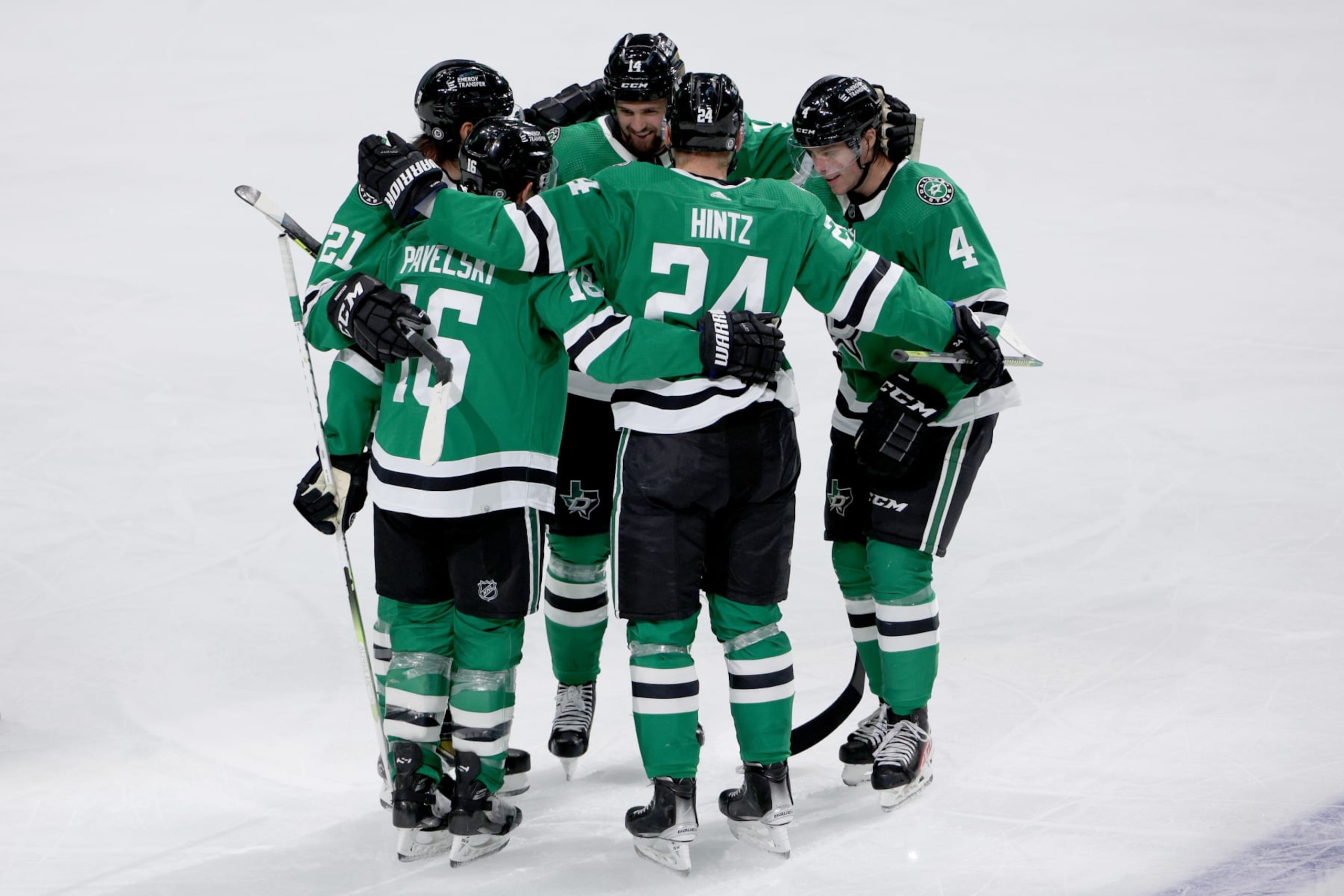 DALLAS, TEXAS - OCTOBER 17: Miro Heiskanen #4 of the Dallas Stars celebrates with Roope Hintz #24, Joe Pavelski #16, Jason Robertson #21 and Jamie Benn #14 of the Dallas Stars after scoring a goal against the Winnipeg Jets in the third period at American Airlines Center on October 17, 2022 in Dallas, Texas. (Photo by Tom Pennington/Getty Images)