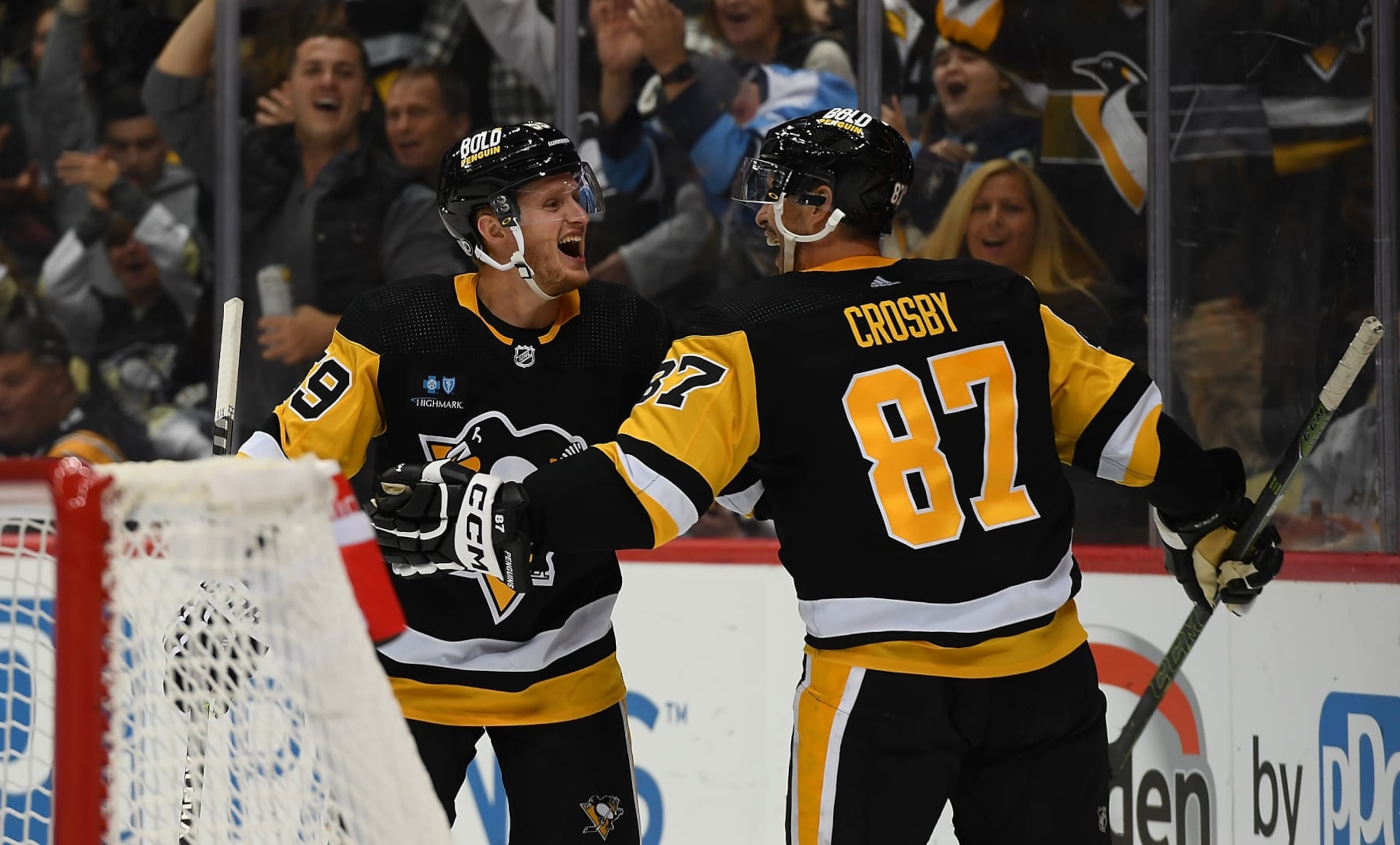 PITTSBURGH, PA - OCTOBER 15: Jake Guentzel #59 of the Pittsburgh Penguins celebrates with Sidney Crosby #87 after scoring a goal in the third period during the game against the Tampa Bay Lightning at PPG PAINTS Arena on October 15, 2022 in Pittsburgh, Pennsylvania. (Photo by Justin Berl/Getty Images)