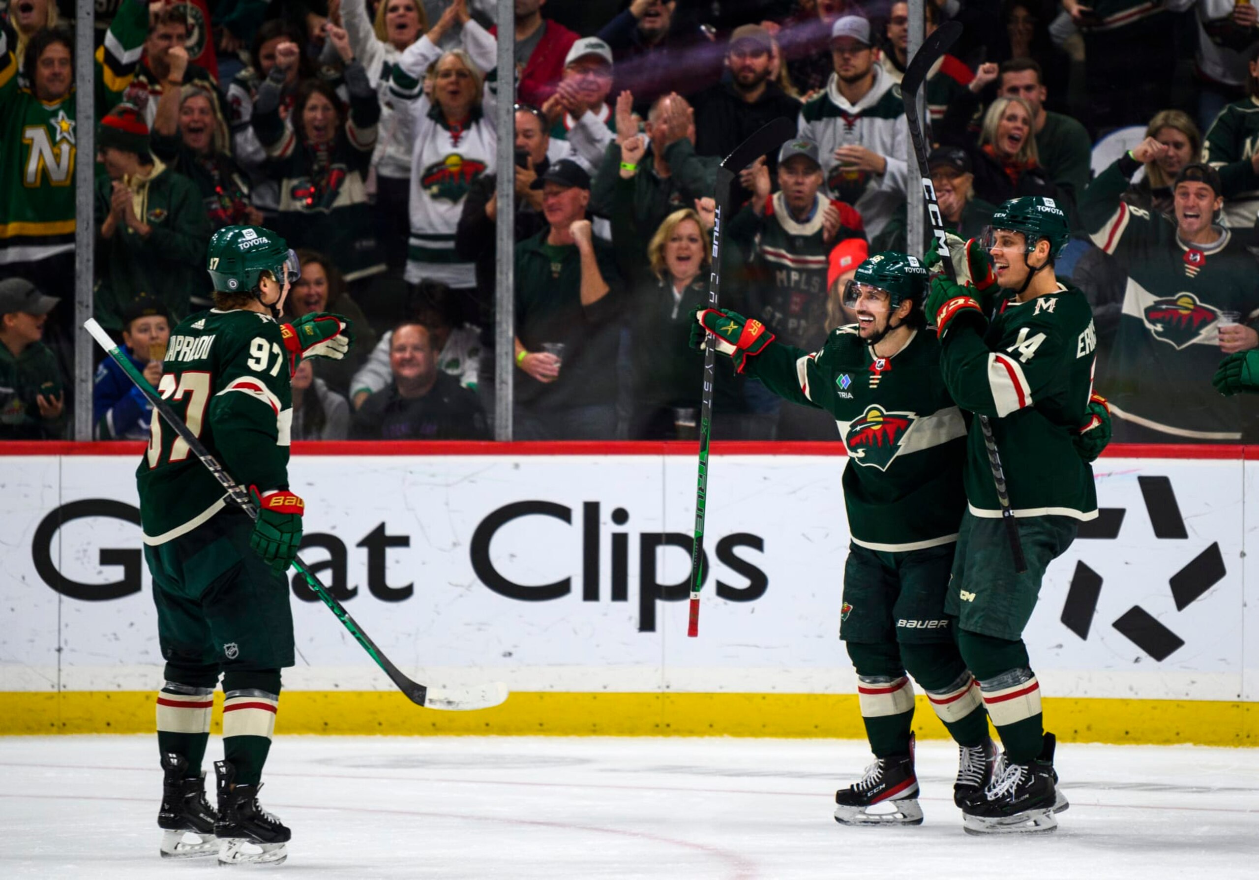 ST PAUL, MN - OCTOBER 20: Mats Zuccarello #36 of the Minnesota Wild celebrates with teammates after scoring a goal in the third period of the game against the Vancouver Canucks at Xcel Energy Center on October 20, 2022 in St Paul, Minnesota. (Photo by Stephen Maturen/Getty Images)