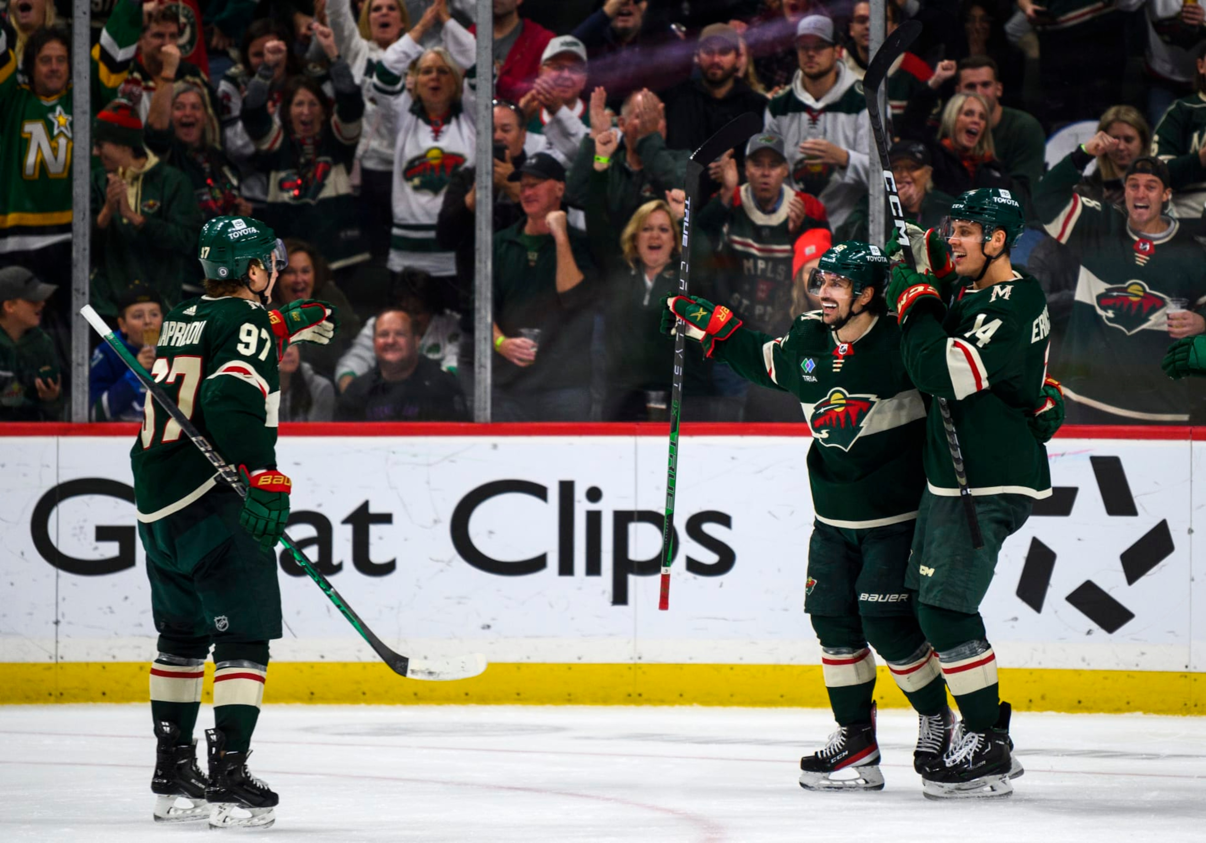 ST PAUL, MN - OCTOBER 20: Mats Zuccarello #36 of the Minnesota Wild celebrates with teammates after scoring a goal in the third period of the game against the Vancouver Canucks at Xcel Energy Center on October 20, 2022 in St Paul, Minnesota. (Photo by Stephen Maturen/Getty Images)