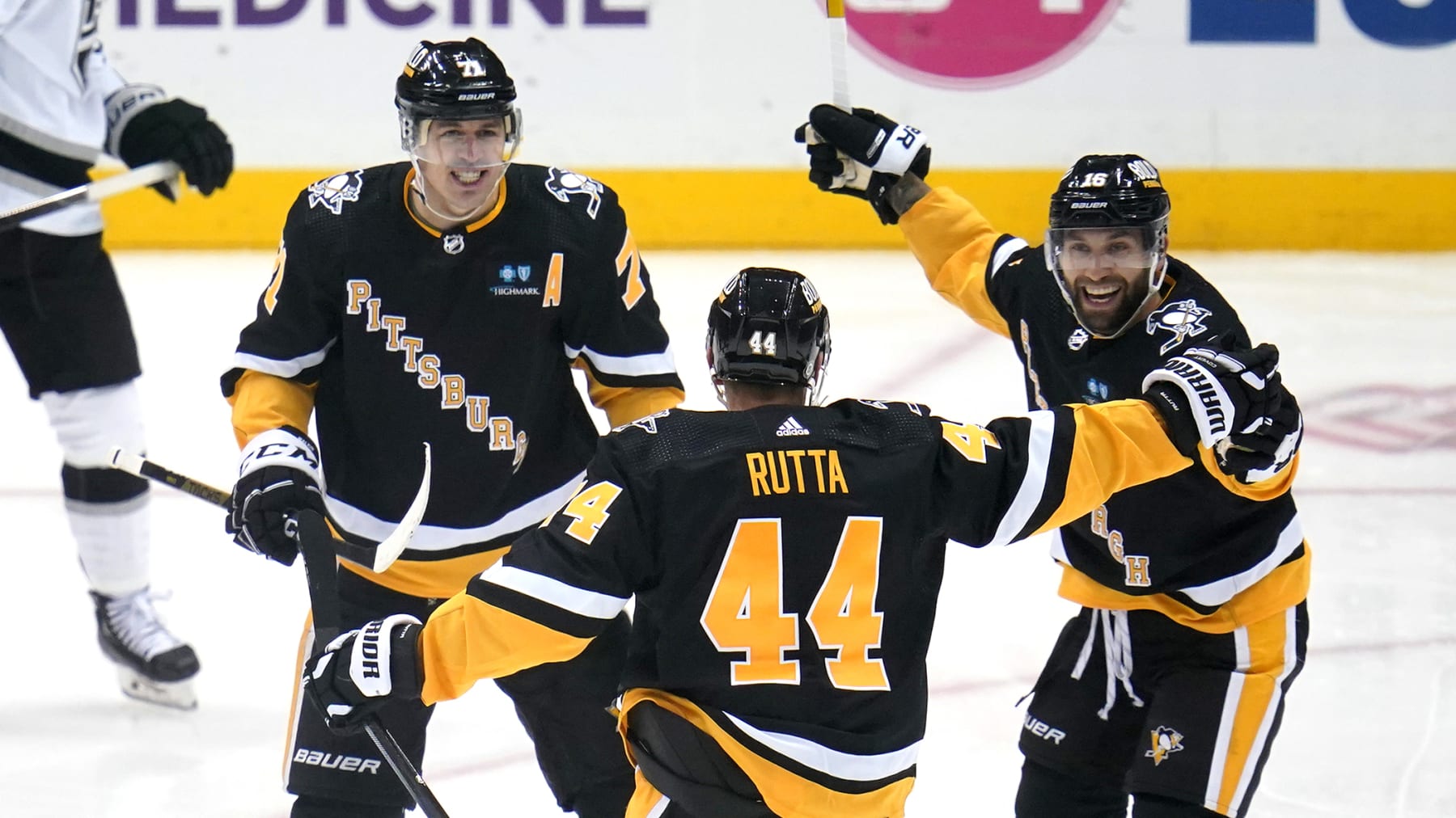 Pittsburgh Penguins' Jan Rutta (44) celebrates his goal against the Los Angeles Kings with Evgeni Malkin (71) and Jason Zucker (16) during the first period of an NHL hockey game in Pittsburgh, Thursday, Oct. 20, 2022. (AP Photo/Gene J. Puskar)