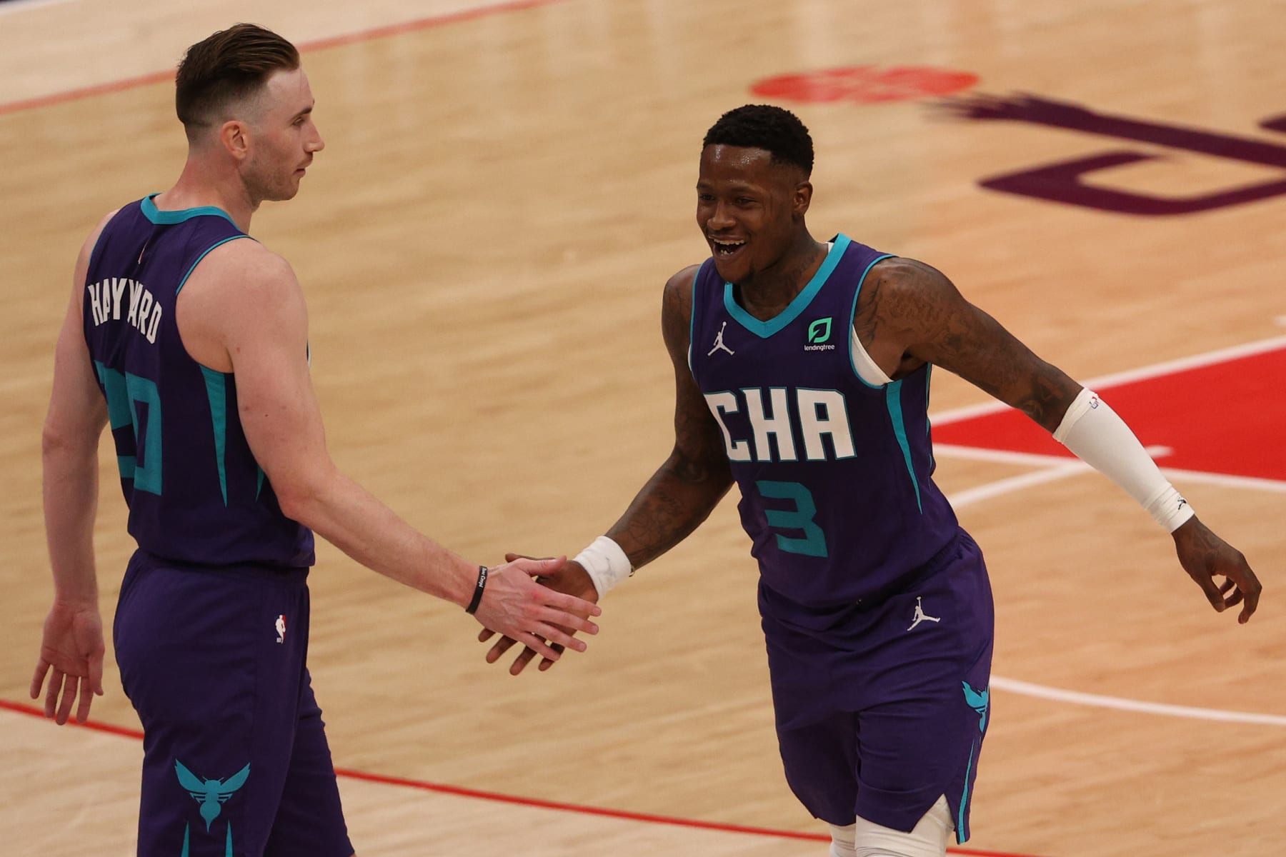 WASHINGTON, DC - MARCH 30: Terry Rozier #3 and Gordon Hayward #20 of the Charlotte Hornets celebrate against the Washington Wizards during the second half at Capital One Arena on March 30, 2021 in Washington, DC. NOTE TO USER: User expressly acknowledges and agrees that, by downloading and or using this photograph, User is consenting to the terms and conditions of the Getty Images License Agreement. (Photo by Patrick Smith/Getty Images)