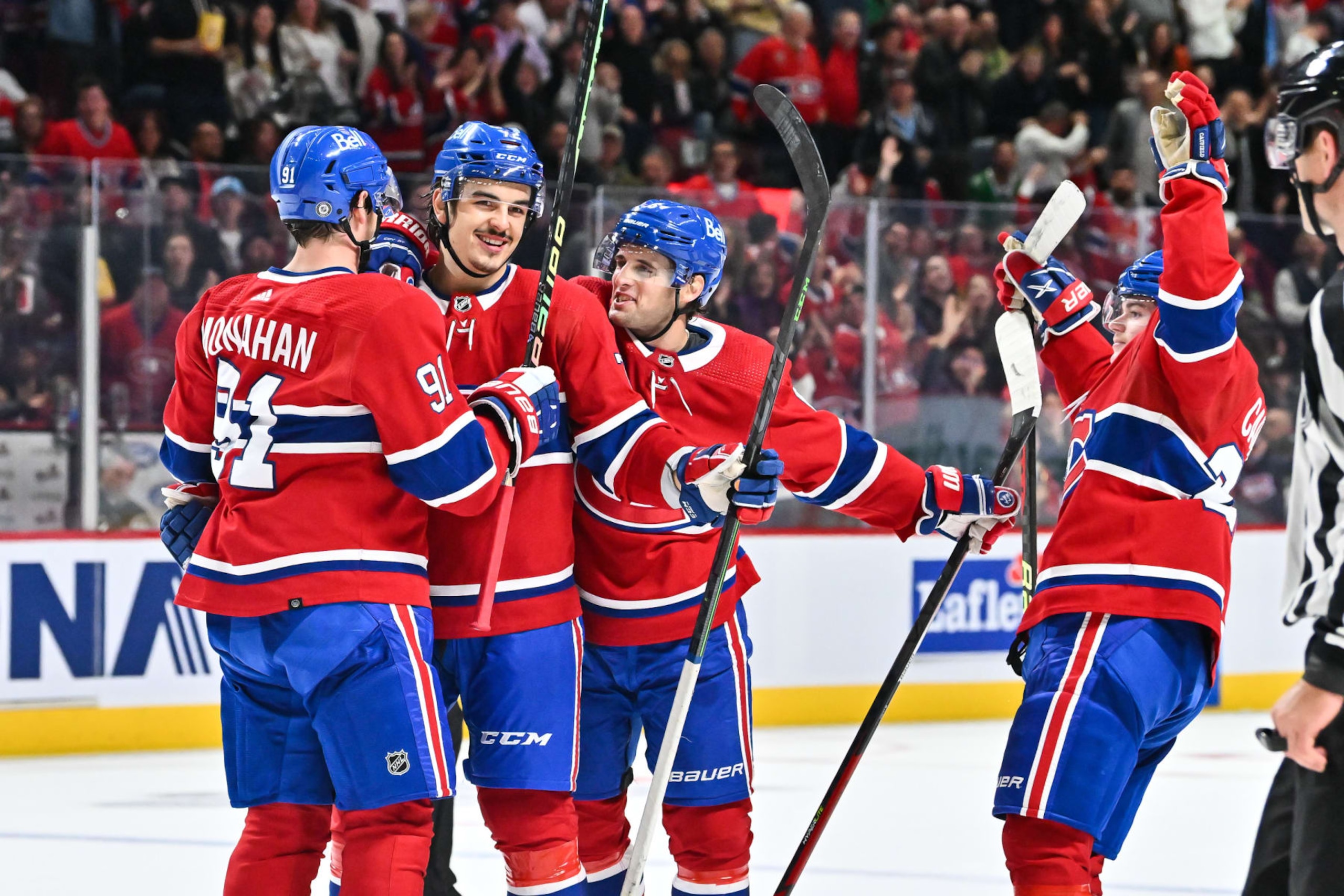 MONTREAL, CANADA - OCTOBER 22:  Arber Xhekaj #72 of the Montreal Canadiens celebrates his first career NHL goal with teammates Sean Monahan #91, Chris Wideman #6 and Cole Caufield #22 of the Montreal Canadiens during the second period of the game against the Dallas Stars at Centre Bell on October 22, 2022 in Montreal, Quebec, Canada.  (Photo by Minas Panagiotakis/Getty Images)