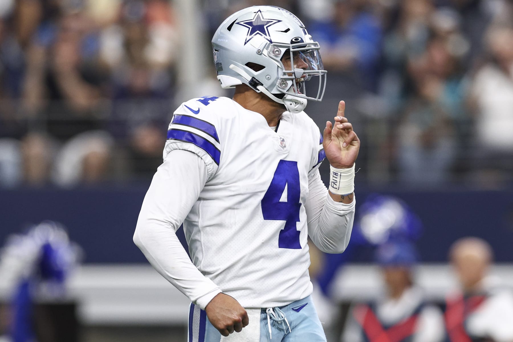 ARLINGTON, TEXAS - OCTOBER 23: Dak Prescott #4 of the Dallas Cowboys reacts after Ezekiel Elliott #21 (not pictured) scored a touchdown against the Detroit Lions during the first quarter at AT&T Stadium on October 23, 2022 in Arlington, Texas. (Photo by Tom Pennington/Getty Images)