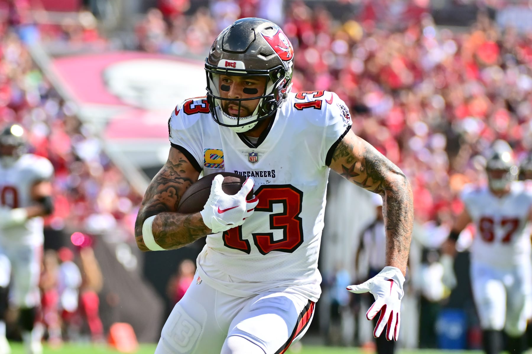 TAMPA, FLORIDA - OCTOBER 09: Mike Evans #13 of the Tampa Bay Buccaneers catches a pass during the second half in the game against the Atlanta Falcons at Raymond James Stadium on October 09, 2022 in Tampa, Florida. (Photo by Julio Aguilar/Getty Images)