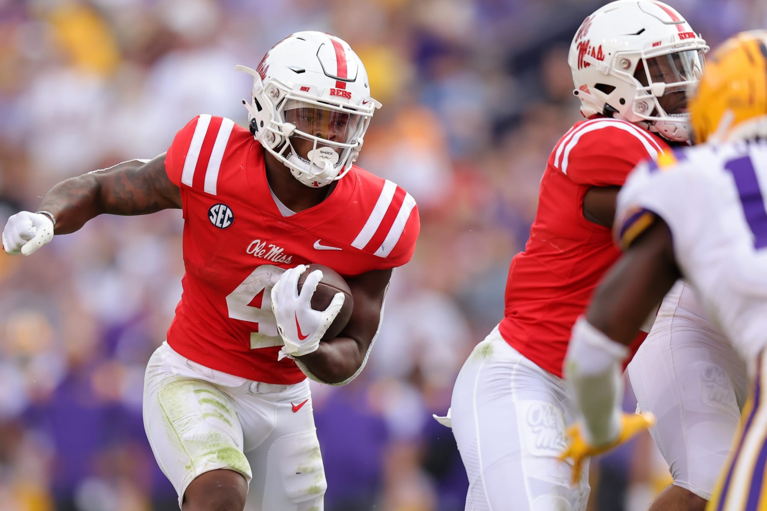 BATON ROUGE, LOUISIANA - OCTOBER 22: Quinshon Judkins #4 of the Mississippi Rebels runs with the ball during the second half of the game against the LSU Tigers at Tiger Stadium on October 22, 2022 in Baton Rouge, Louisiana. (Photo by Jonathan Bachman/Getty Images)