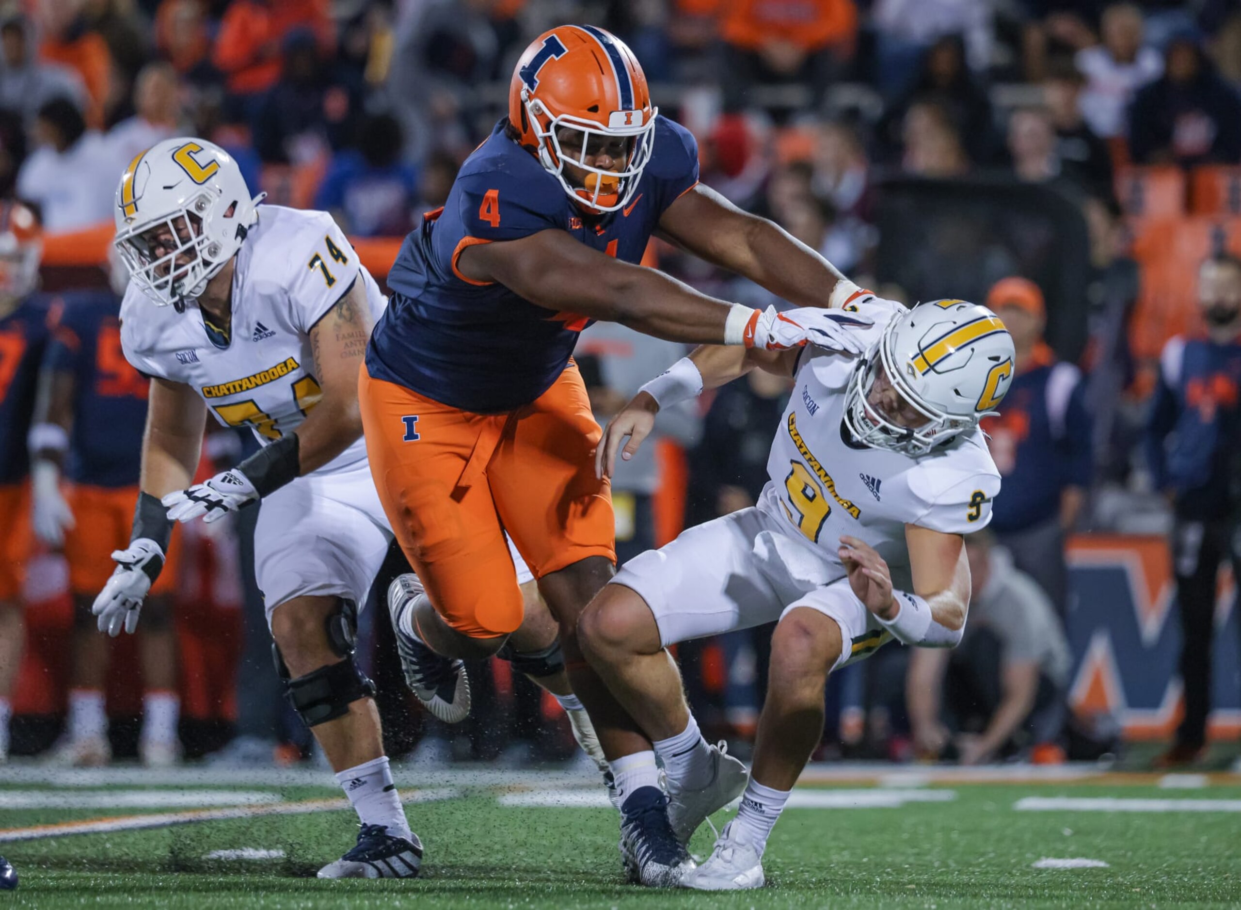 CHAMPAIGN, IL - SEPTEMBER 22: Jer'Zhan Newton #4 of the Illinois Fighting Illini lays a hit on Preston Hutchinson #9 of the Chattanooga Mocs during the game at Memorial Stadium on September 22, 2022 in Champaign, Illinois. (Photo by Michael Hickey/Getty Images)