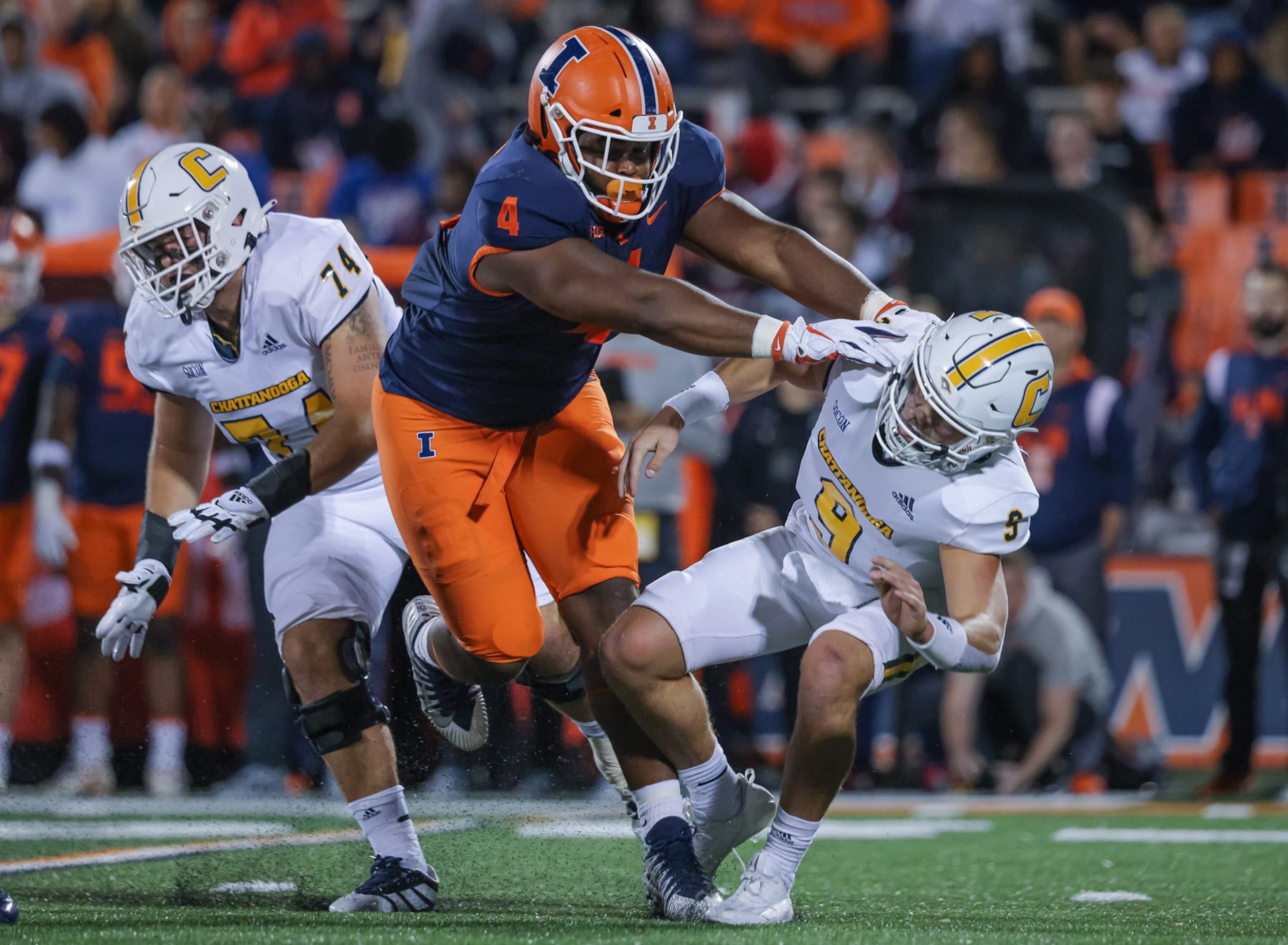 CHAMPAIGN, IL - SEPTEMBER 22: Jer'Zhan Newton #4 of the Illinois Fighting Illini lays a hit on Preston Hutchinson #9 of the Chattanooga Mocs during the game at Memorial Stadium on September 22, 2022 in Champaign, Illinois. (Photo by Michael Hickey/Getty Images)