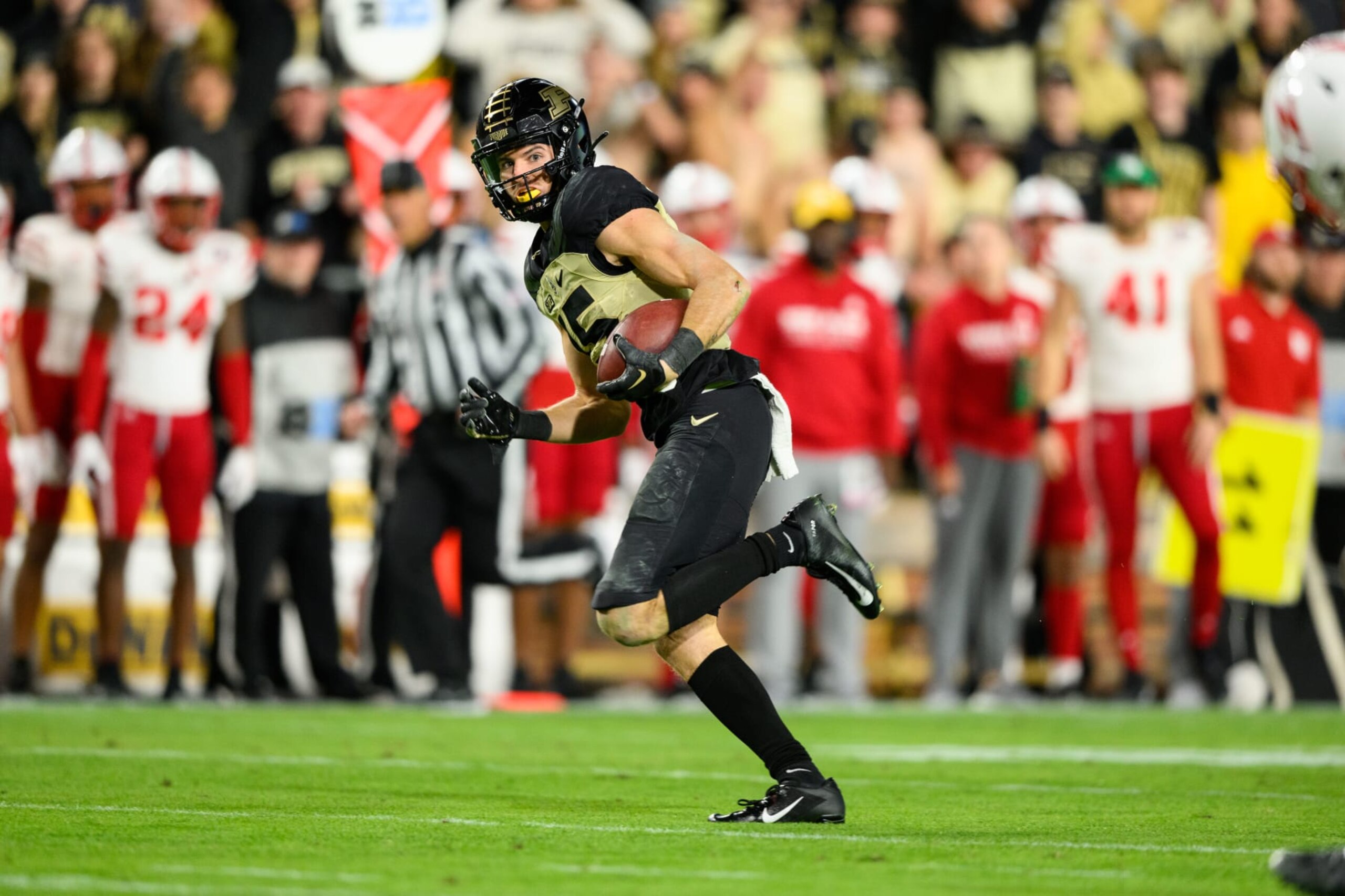 WEST LAFAYETTE, IN - OCTOBER 15: Purdue Boilermakers wide receiver Charlie Jones (15) breaks away  for a touchdown during the college football game between the Purdue Boilermakers and Nebraska Cornhuskers on October 15, 2022, at Ross-Ade Stadium in West Lafayette, IN. (Photo by Zach Bolinger/Icon Sportswire via Getty Images)