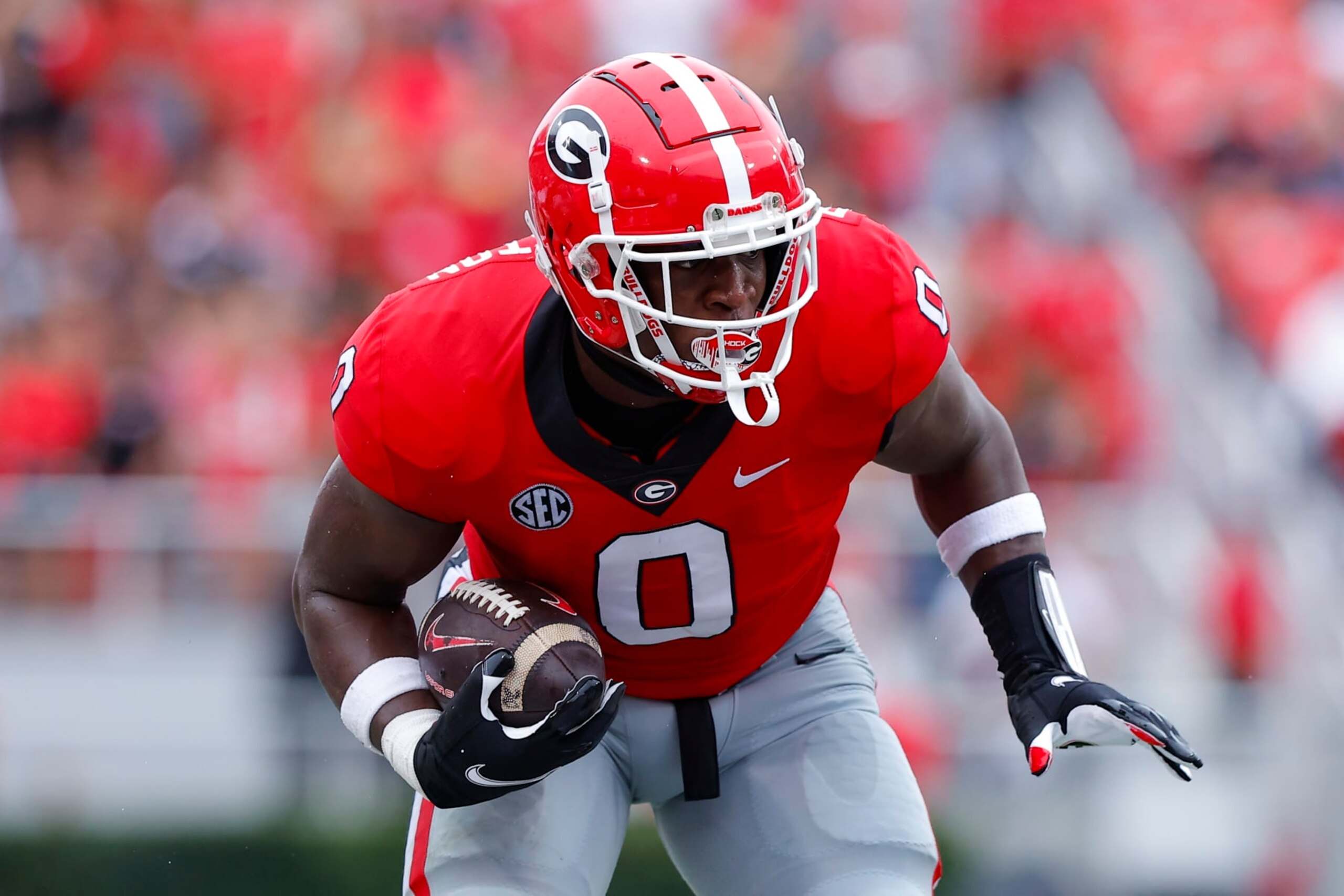 ATHENS, GA - SEPTEMBER 10: Darnell Washington #0 of the Georgia Bulldogs looks for yardage in the first half against the Samford Bulldogs at Sanford Stadium on September 10, 2022 in Atlanta, Georgia. (Photo by Todd Kirkland/Getty Images)