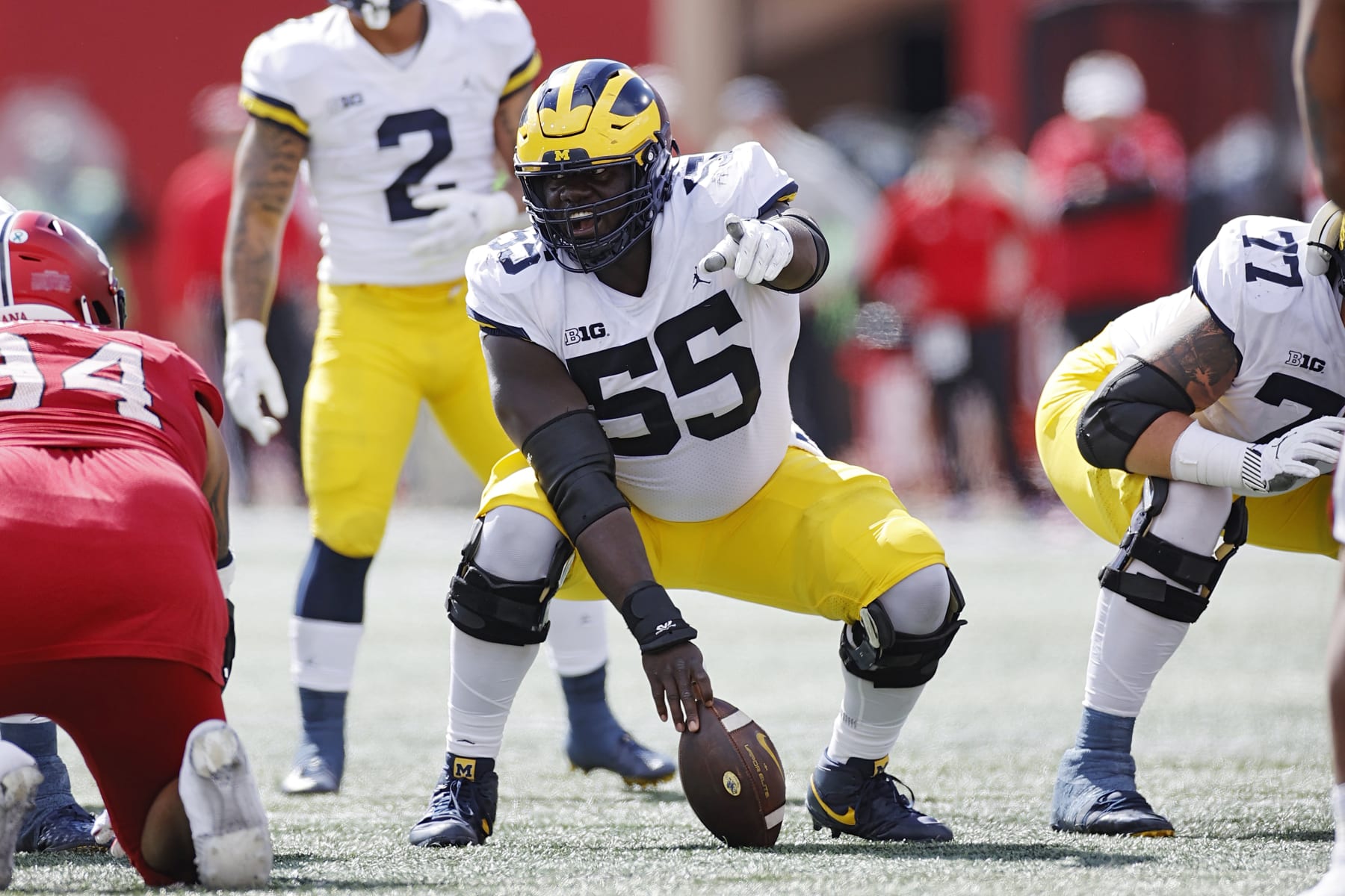 BLOOMINGTON, IN - OCTOBER 08: Michigan Wolverines offensive lineman Olusegun Oluwatimi (55) looks over the defense before snapping the ball during a college football game against the Indiana Hoosiers on October 8, 2022 at Memorial Stadium in Bloomington, Indiana. (Photo by Joe Robbins/Icon Sportswire via Getty Images)