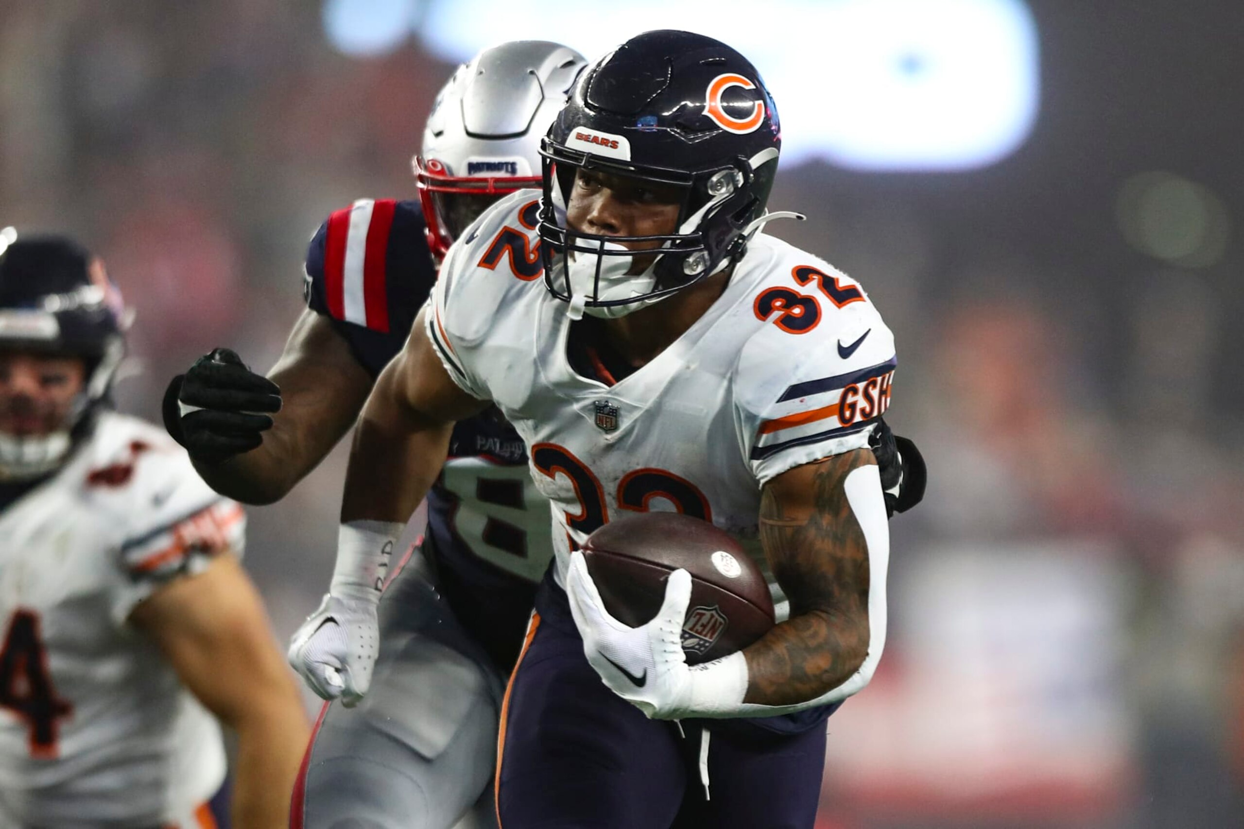 FOXBOROUGH, MA - OCTOBER 24: David Montgomery #32 of the Chicago Bears carries the ball during the fourth quarter of an NFL football game against the New England Patriots at Gillette Stadium on October 24, 2022 in Foxborough, Massachusetts. (Photo by Kevin Sabitus/Getty Images)