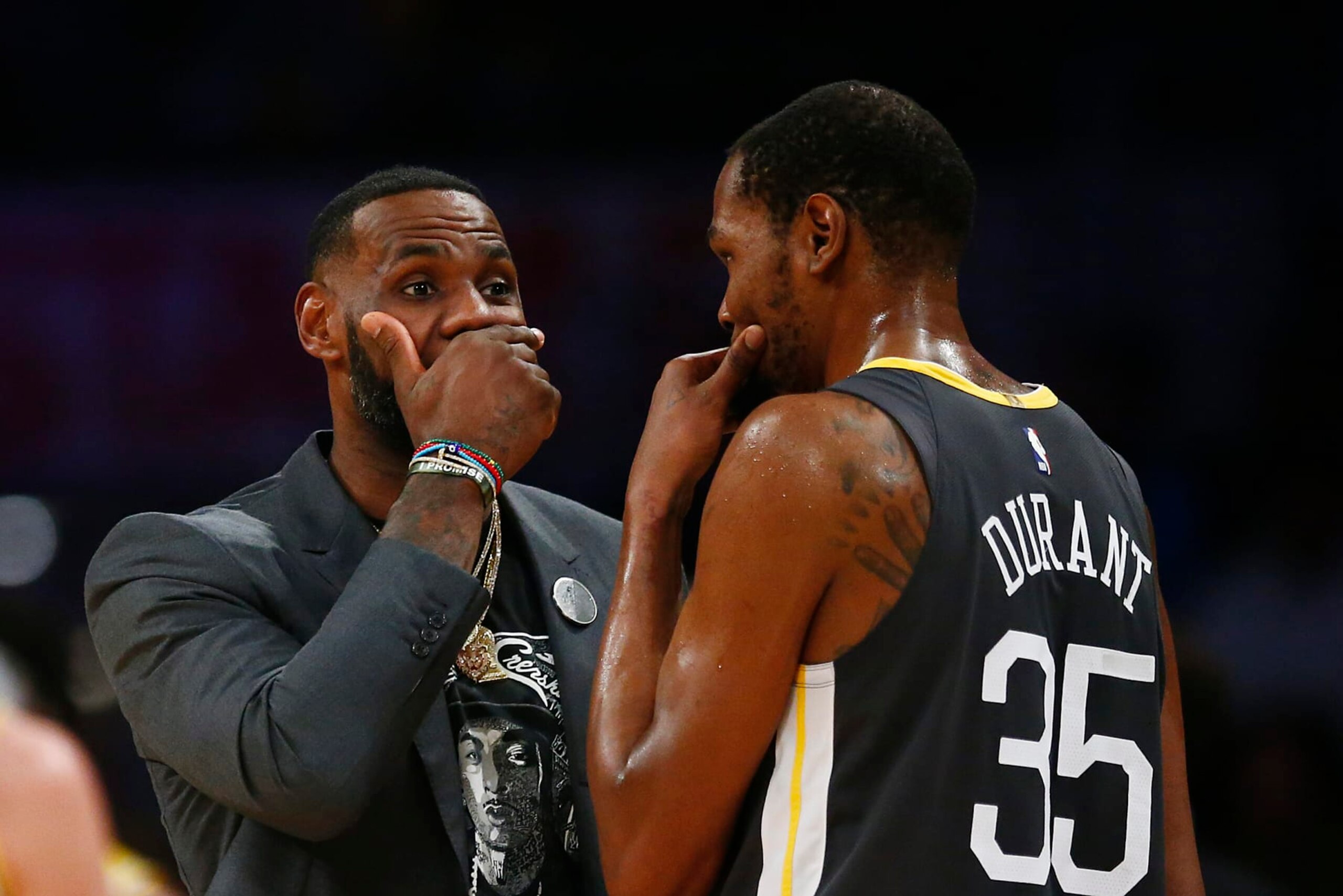 LOS ANGELES, CALIFORNIA - APRIL 04: LeBron James #23 of the Los Angeles Lakers speaks to Kevin Durant #35 of the Golden State Warriors during a timeout in the first half at Staples Center on April 04, 2019 in Los Angeles, California. NOTE TO USER: User expressly acknowledges and agrees that, by downloading and or using this photograph, User is consenting to the terms and conditions of the Getty Images License Agreement. (Photo by Yong Teck Lim/Getty Images)