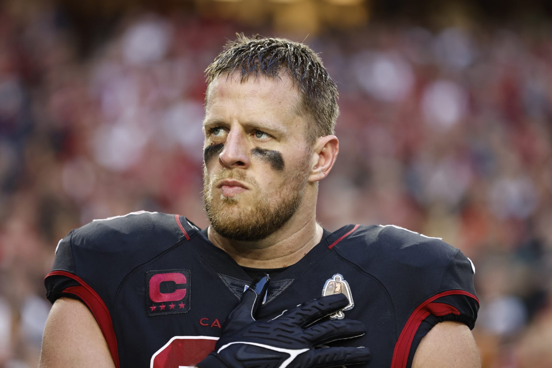 GLENDALE, ARIZONA - OCTOBER 20: J.J. Watt #99 of the Arizona Cardinals looks on during the national anthem prior to an NFL football game between the Arizona Cardinals and the New Orleans Saints at State Farm Stadium on October 20, 2022 in Glendale, Arizona. (Photo by Michael Owens/Getty Images) GLENDALE, ARIZONA - OCTOBER 20: J.J. Watt #99 of the Arizona Cardinals looks on during the national anthem prior to an NFL football game between the Arizona Cardinals and the New Orleans Saints at State Farm Stadium on October 20, 2022 in Glendale, Arizona. (Photo by Michael Owens/Getty Images)
