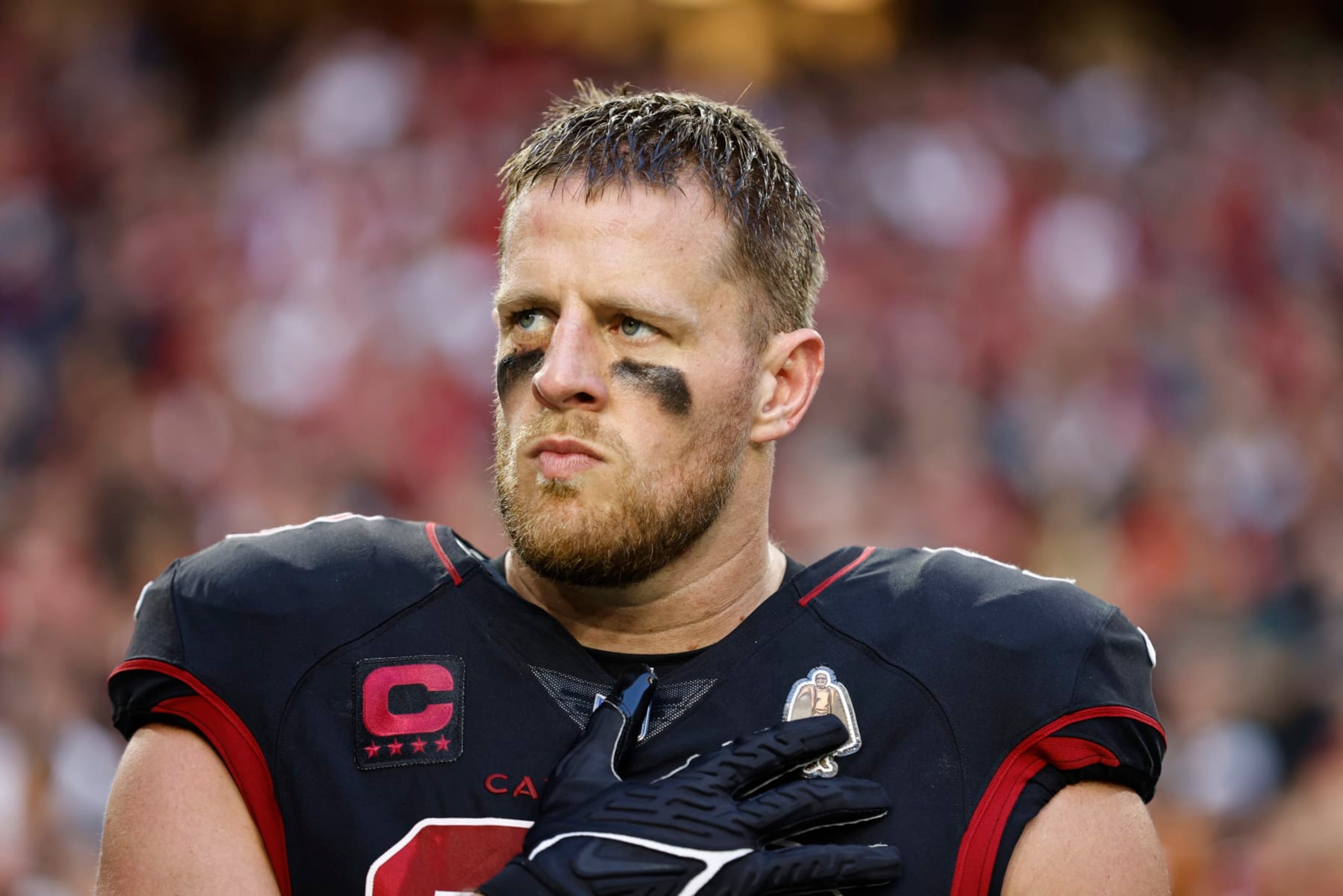 GLENDALE, ARIZONA - OCTOBER 20: J.J. Watt #99 of the Arizona Cardinals looks on during the national anthem prior to an NFL football game between the Arizona Cardinals and the New Orleans Saints at State Farm Stadium on October 20, 2022 in Glendale, Arizona. (Photo by Michael Owens/Getty Images)