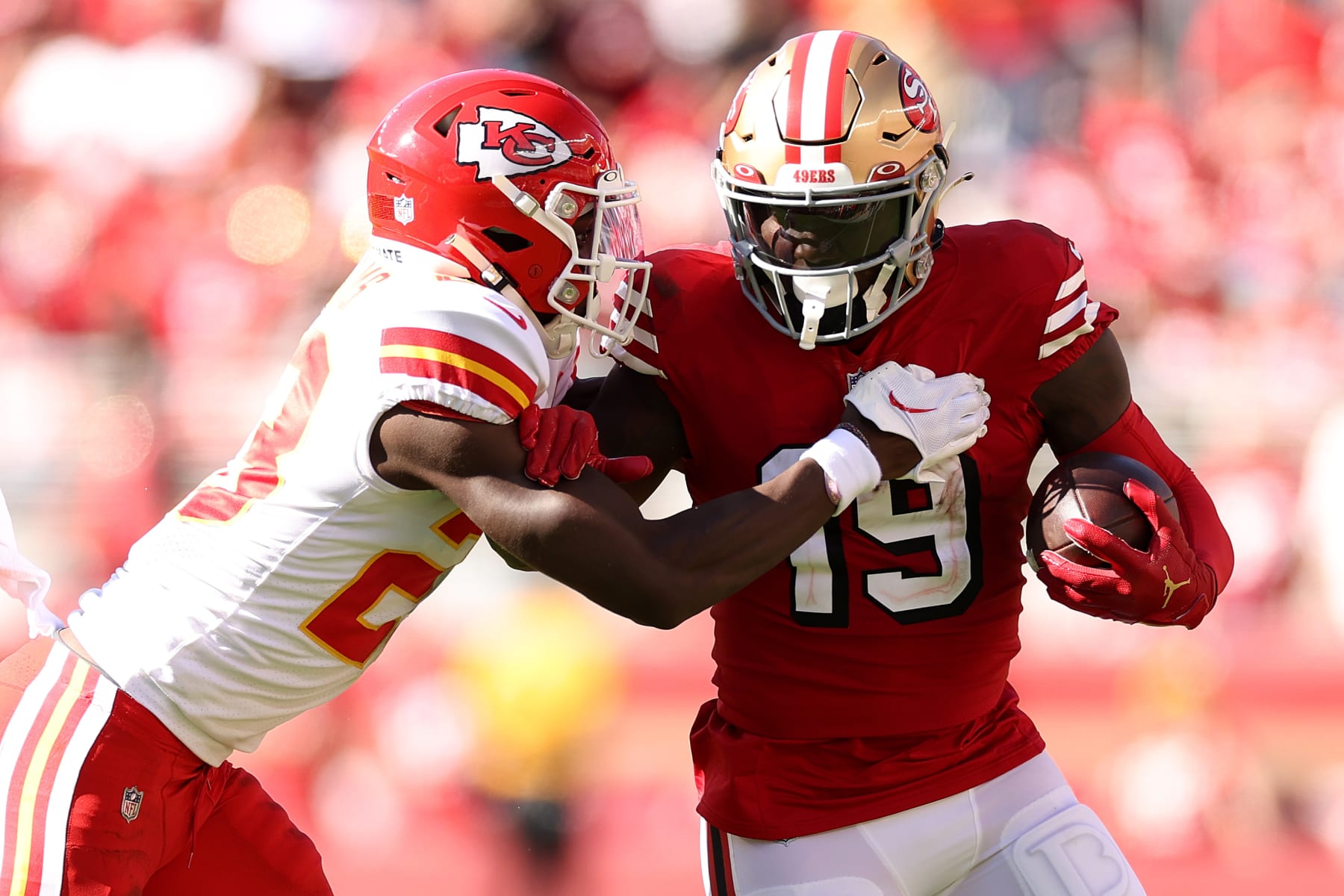 SANTA CLARA, CALIFORNIA - OCTOBER 23: Joshua Williams #23 of the Kansas City Chiefs tackles Deebo Samuel #19 of the San Francisco 49ers in the second quarter at Levi's Stadium on October 23, 2022 in Santa Clara, California. (Photo by Ezra Shaw/Getty Images)