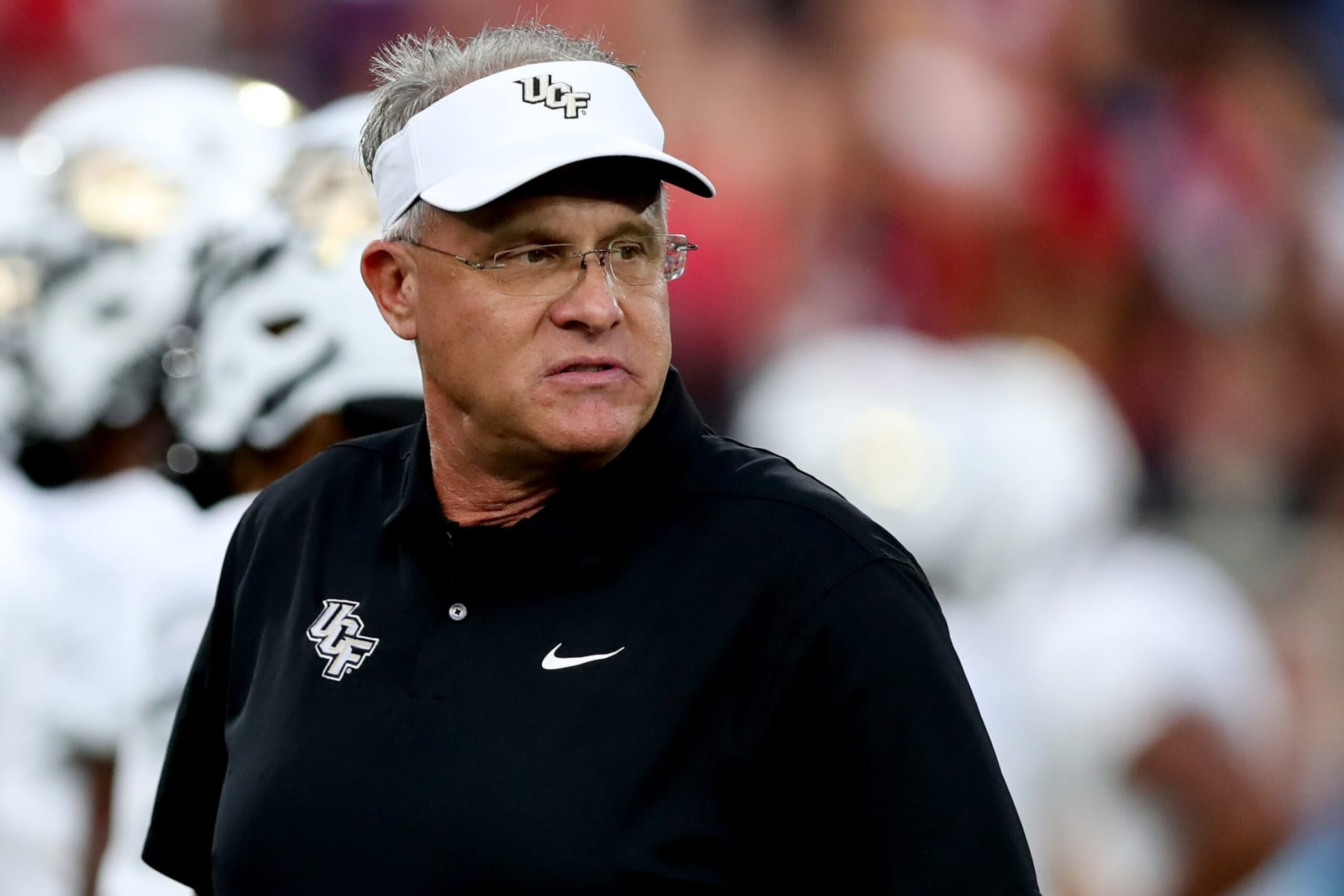 BOCA RATON, FLORIDA - SEPTEMBER 17: Head coach Gus Malzahn of the UCF Knights looks on during pregame warm-ups prior to a game against the Florida Atlantic Owls at FAU Stadium on September 17, 2022 in Boca Raton, Florida. (Photo by Megan Briggs/Getty Images) BOCA RATON, FLORIDA - SEPTEMBER 17: Head coach Gus Malzahn of the UCF Knights looks on during pregame warm-ups prior to a game against the Florida Atlantic Owls at FAU Stadium on September 17, 2022 in Boca Raton, Florida. (Photo by Megan Briggs/Getty Images)
