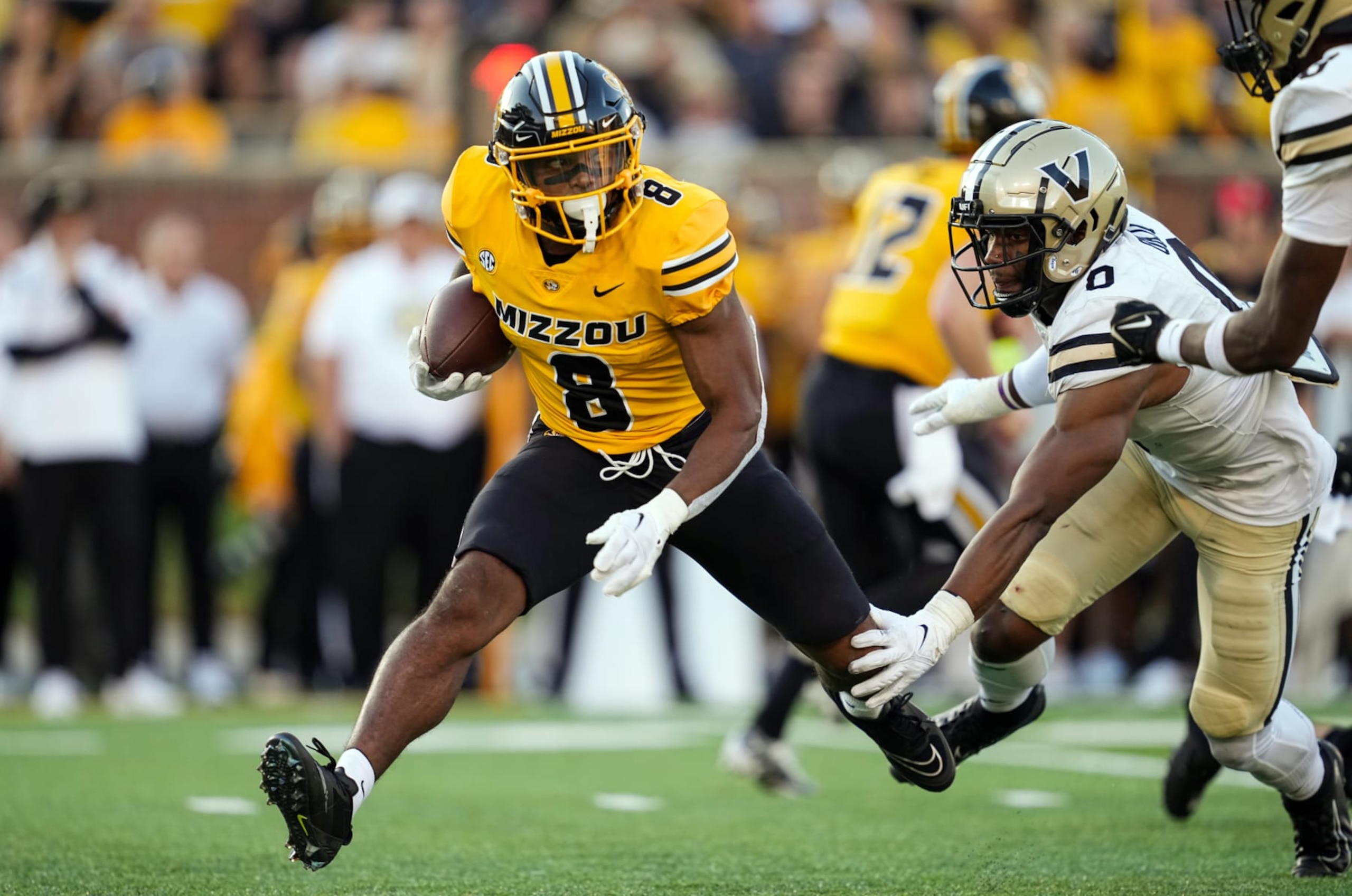 COLUMBIA, MO - OCTOBER 22: Nathaniel Peat #8 of the Missouri Tigers runs the ball against Anfernee Orji #0 of the Vanderbilt Commodores during the second half at Faurot Field/Memorial Stadium on October 22, 2022 in Columbia, Missouri. (Photo by Jay Biggerstaff/Getty Images) COLUMBIA, MO - OCTOBER 22: Nathaniel Peat #8 of the Missouri Tigers runs the ball against Anfernee Orji #0 of the Vanderbilt Commodores during the second half at Faurot Field/Memorial Stadium on October 22, 2022 in Columbia, Missouri. (Photo by Jay Biggerstaff/Getty Images)
