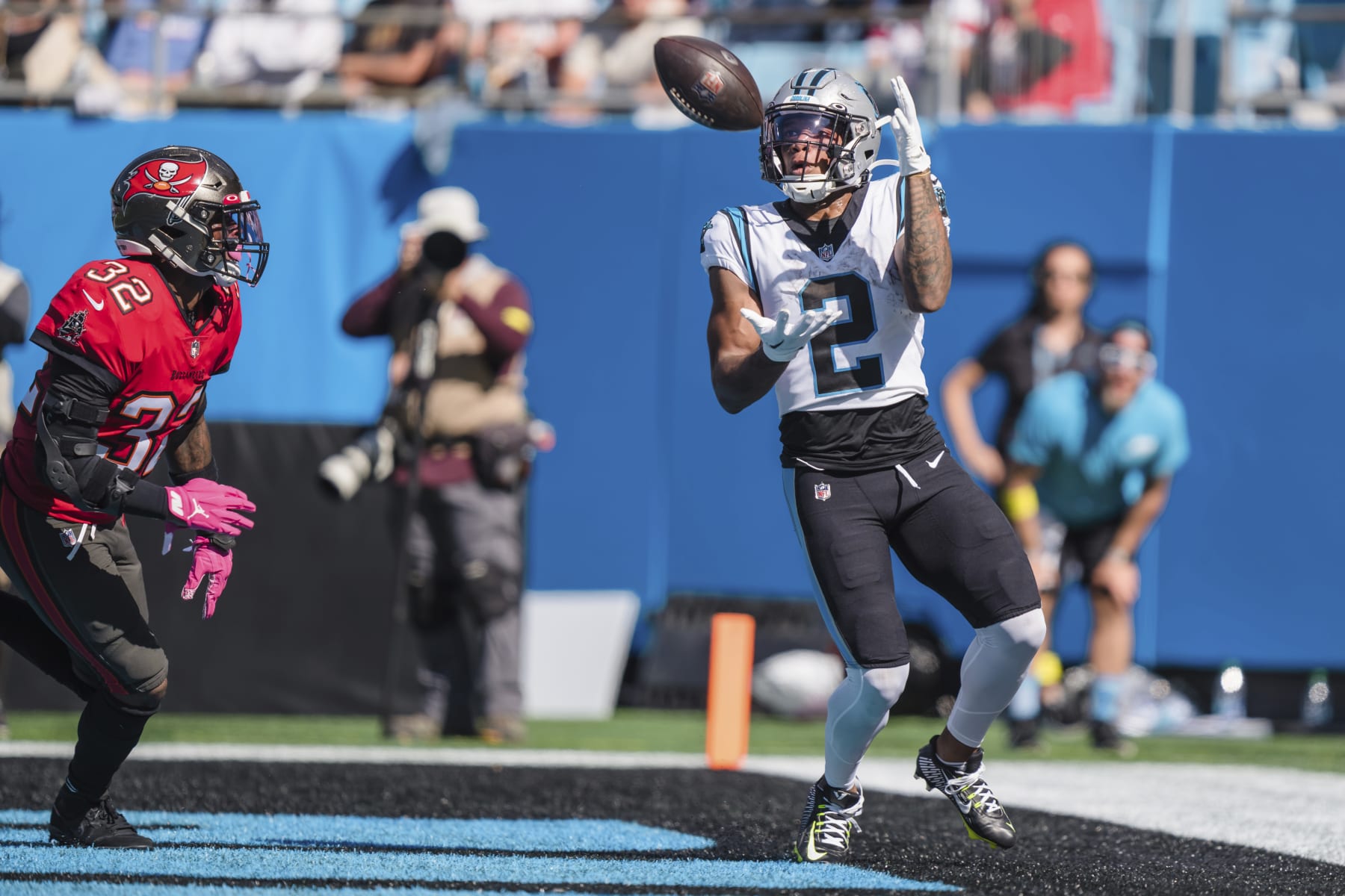 Carolina Panthers wide receiver DJ Moore (2) hauls in a touchdown pass in front of Tampa Bay Buccaneers safety Mike Edwards (32) during the first half of an NFL football game Sunday, Oct. 23, 2022, in Charlotte, N.C. (AP Photo/Jacob Kupferman)