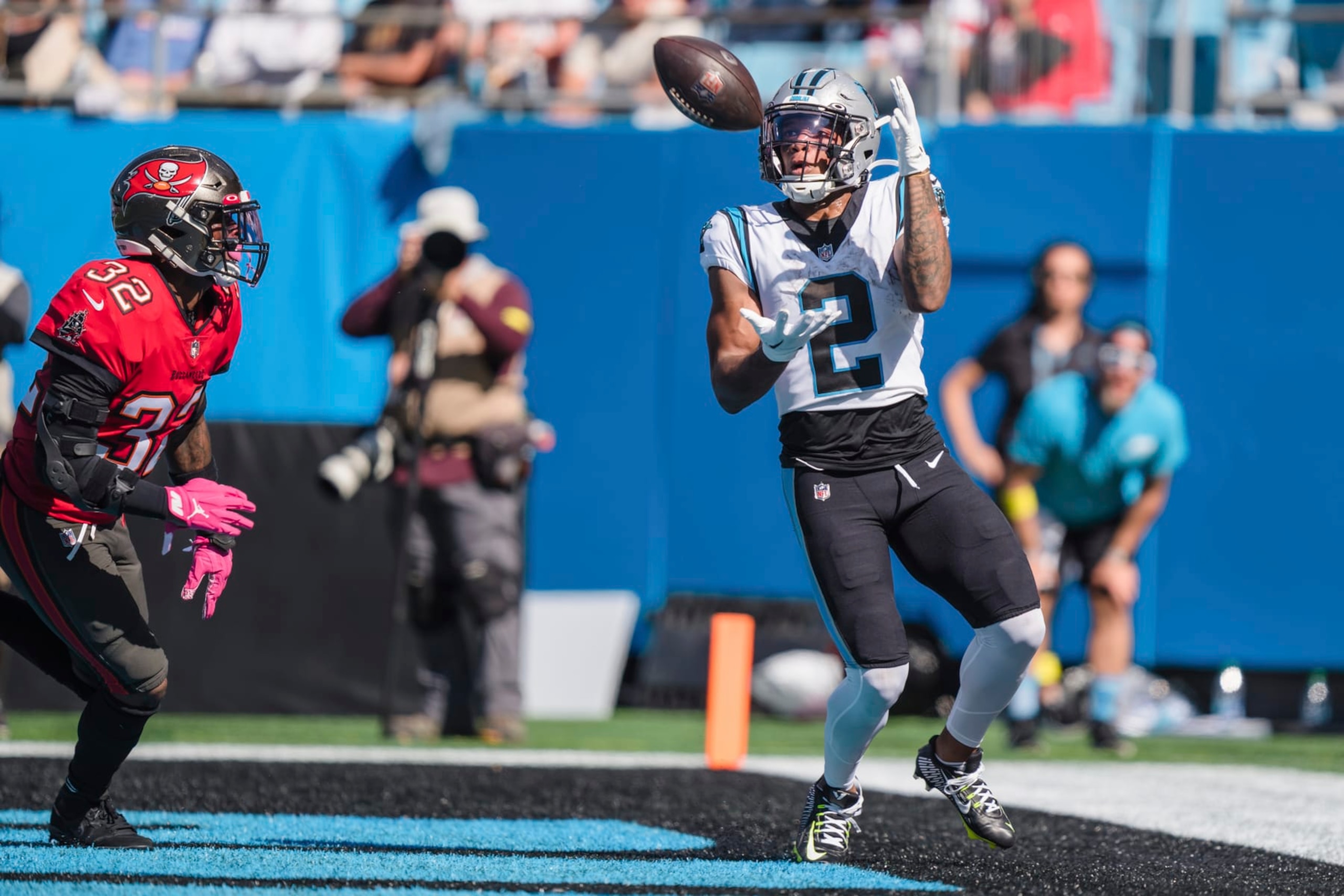 Carolina Panthers wide receiver DJ Moore (2) hauls in a touchdown pass in front of Tampa Bay Buccaneers safety Mike Edwards (32) during the first half of an NFL football game Sunday, Oct. 23, 2022, in Charlotte, N.C. (AP Photo/Jacob Kupferman)