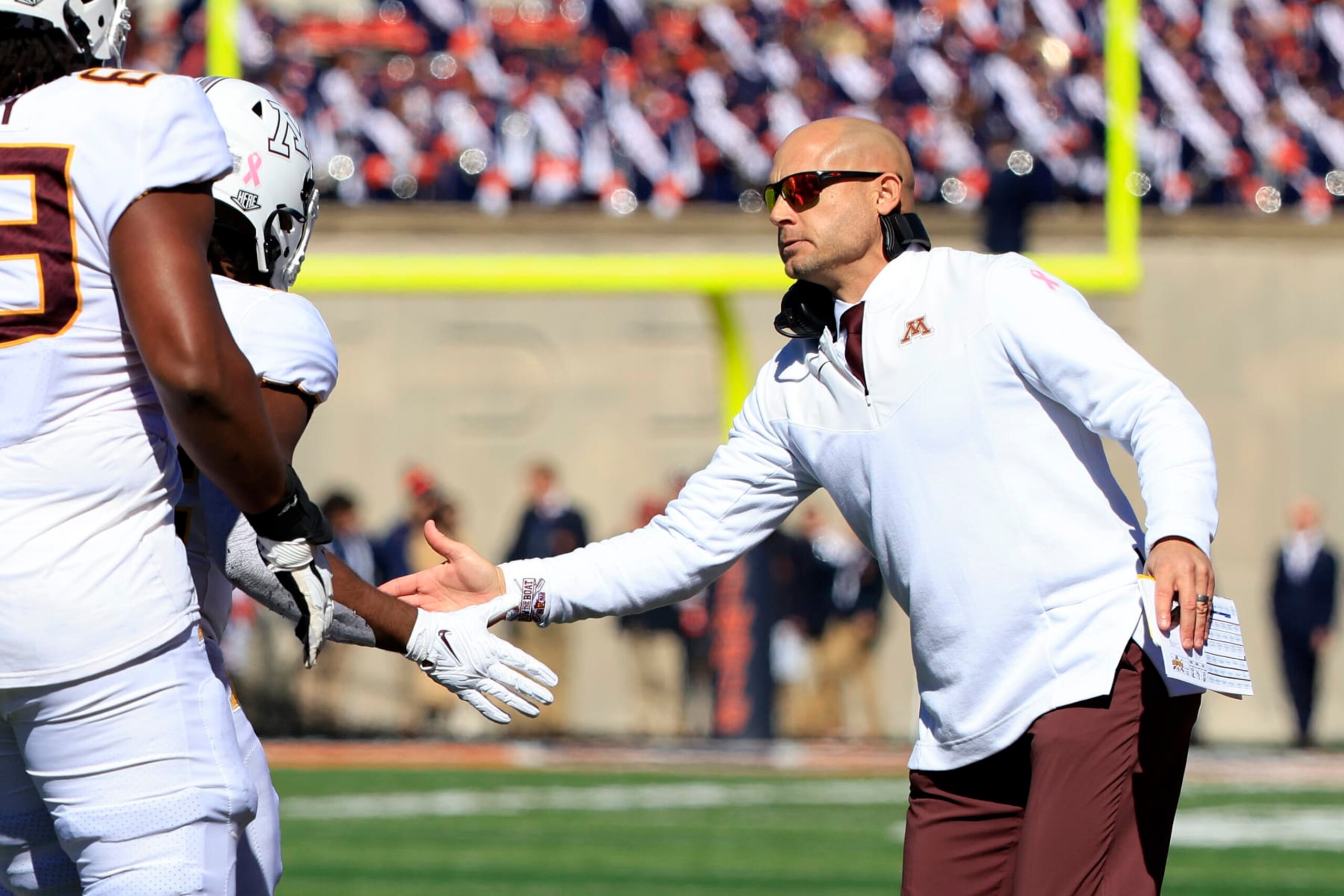 CHAMPAIGN, ILLINOIS - OCTOBER 15: Head coach P. J. Fleck of the Minnesota Golden Gophers celebrates a touchdown with his team during the first half in the game against the Illinois Fighting Illini at Memorial Stadium on October 15, 2022 in Champaign, Illinois. (Photo by Justin Casterline/Getty Images) CHAMPAIGN, ILLINOIS - OCTOBER 15: Head coach P. J. Fleck of the Minnesota Golden Gophers celebrates a touchdown with his team during the first half in the game against the Illinois Fighting Illini at Memorial Stadium on October 15, 2022 in Champaign, Illinois. (Photo by Justin Casterline/Getty Images)