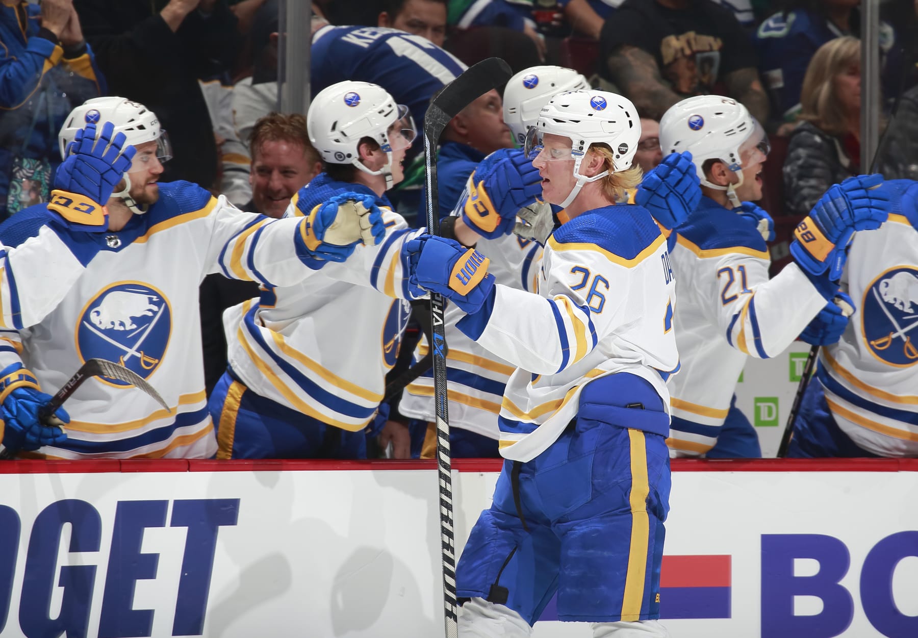 VANCOUVER, CANADA - OCTOBER 22: Rasmus Dahlin #26 of the Buffalo Sabres is congratulated by teammates after scoring during their NHL game against the Vancouver Canucks at Rogers Arena October 22, 2022 in Vancouver, British Columbia, Canada.  (Photo by Jeff Vinnick/NHLI via Getty Images)