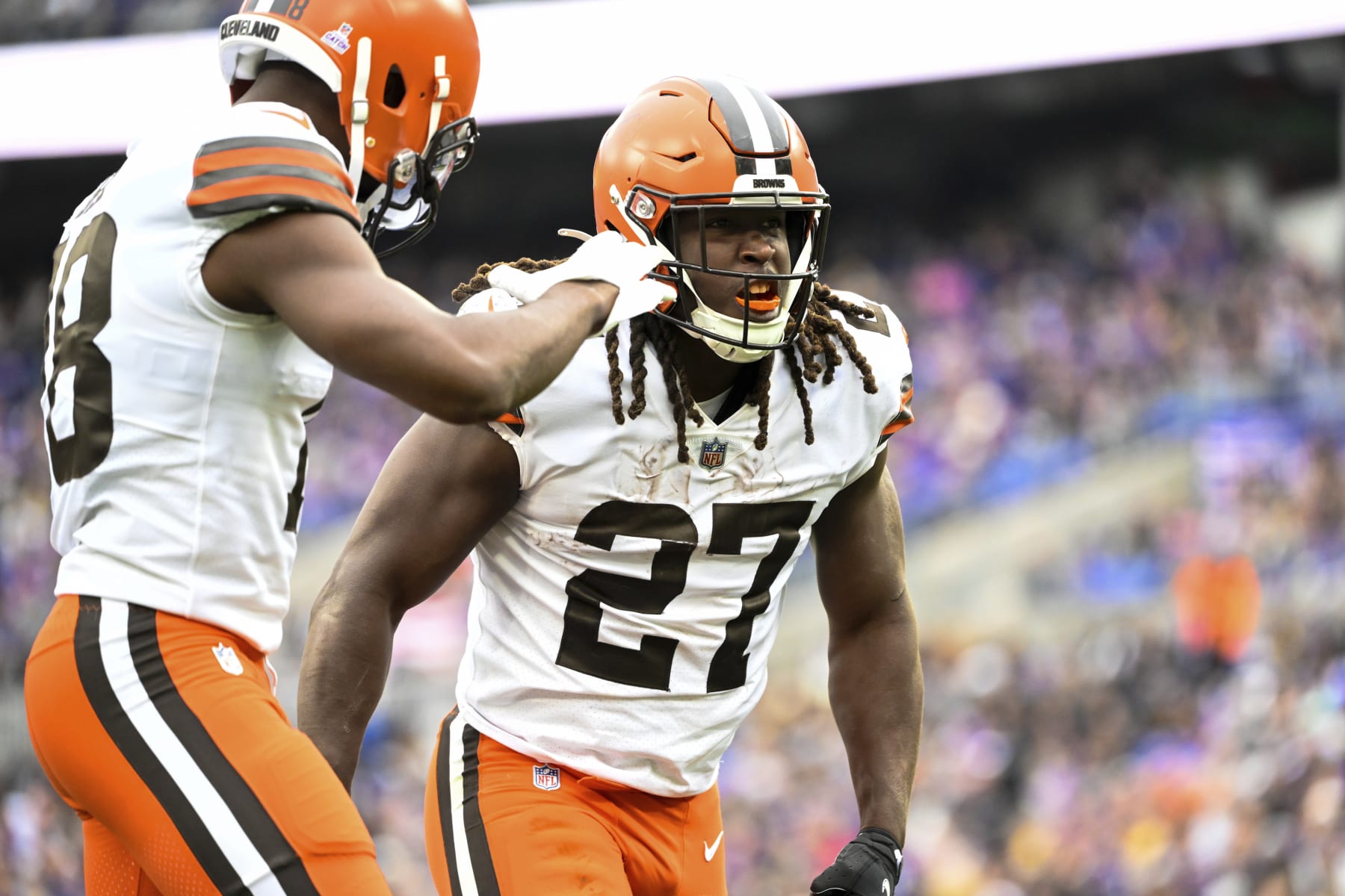 Cleveland Browns running back Kareem Hunt (27) celebrates his second half touchdown with wide receiver David Bell during a NFL football game against the Baltimore Ravens, Sunday, Oct. 23, 2022, in Baltimore. (AP Photo/Terrance Williams)