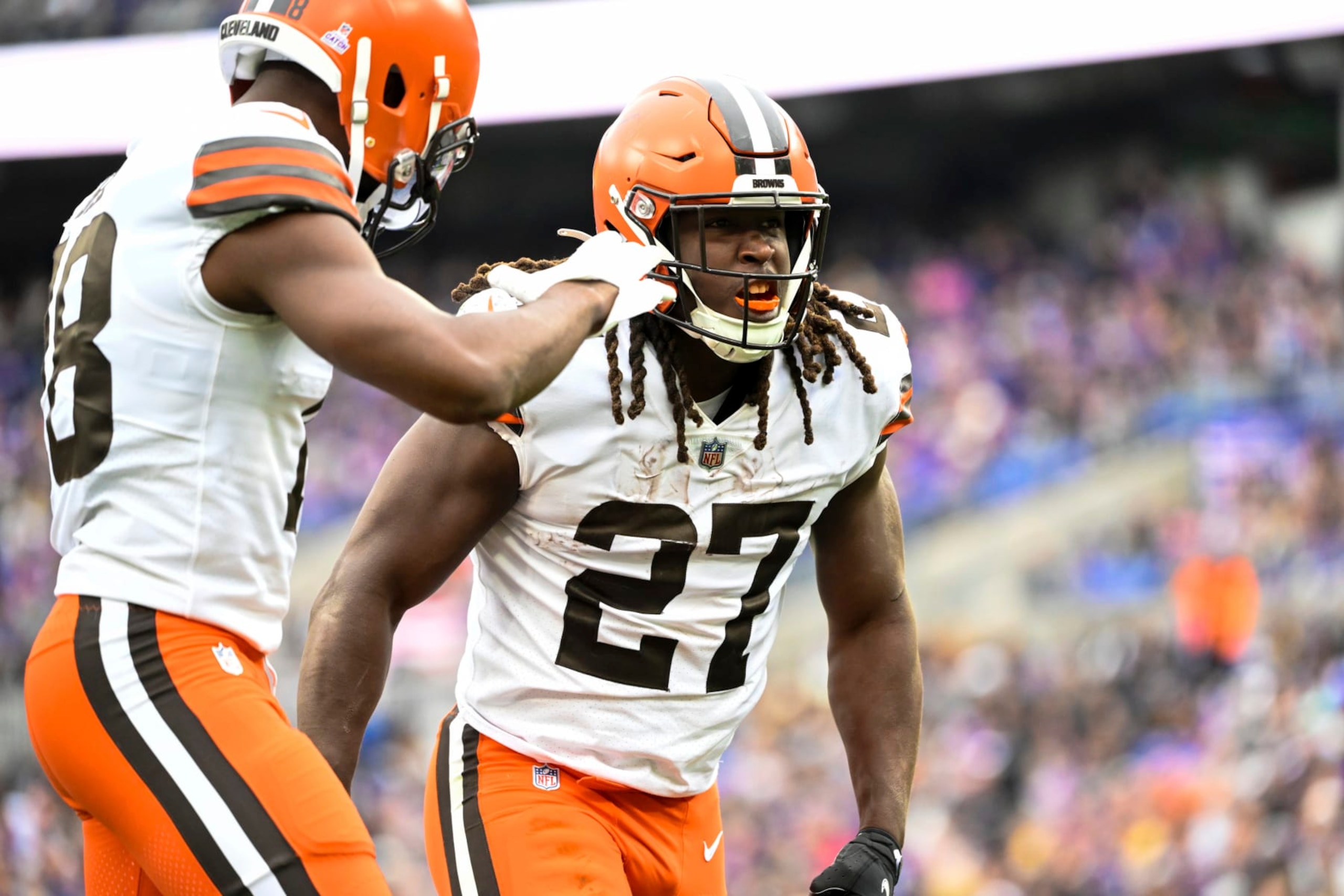 Cleveland Browns running back Kareem Hunt (27) celebrates his second half touchdown with wide receiver David Bell during a NFL football game against the Baltimore Ravens, Sunday, Oct. 23, 2022, in Baltimore. (AP Photo/Terrance Williams)