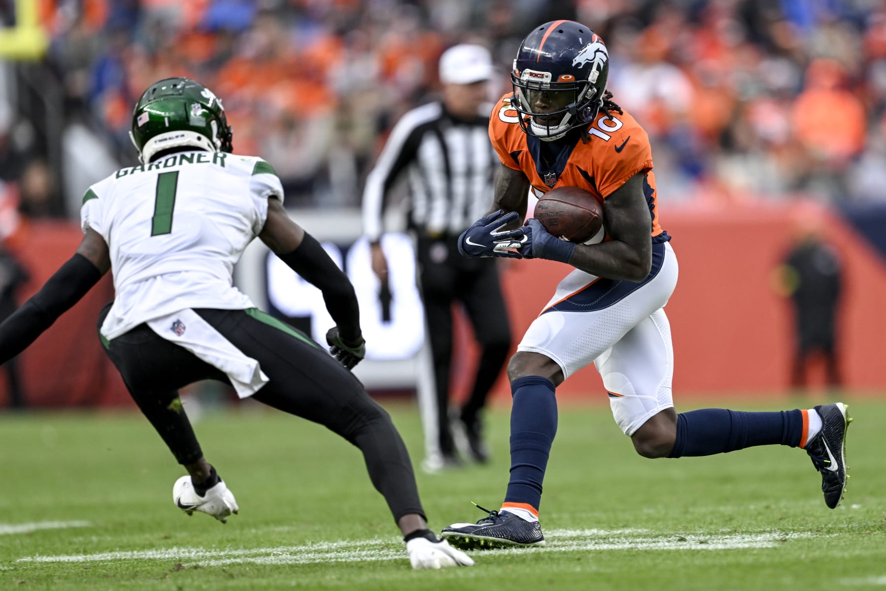 DENVER, CO - OCTOBER 23: Jerry Jeudy (10) of the Denver Broncos runs after making a catch as Sauce Gardner (1) of the New York Jets pursues during the second half of New Yorks 16-9 win at Empower Field at Mile High in Denver on Sunday, October 23, 2022. (Photo by AAron Ontiveroz/MediaNews Group/The Denver Post via Getty Images)