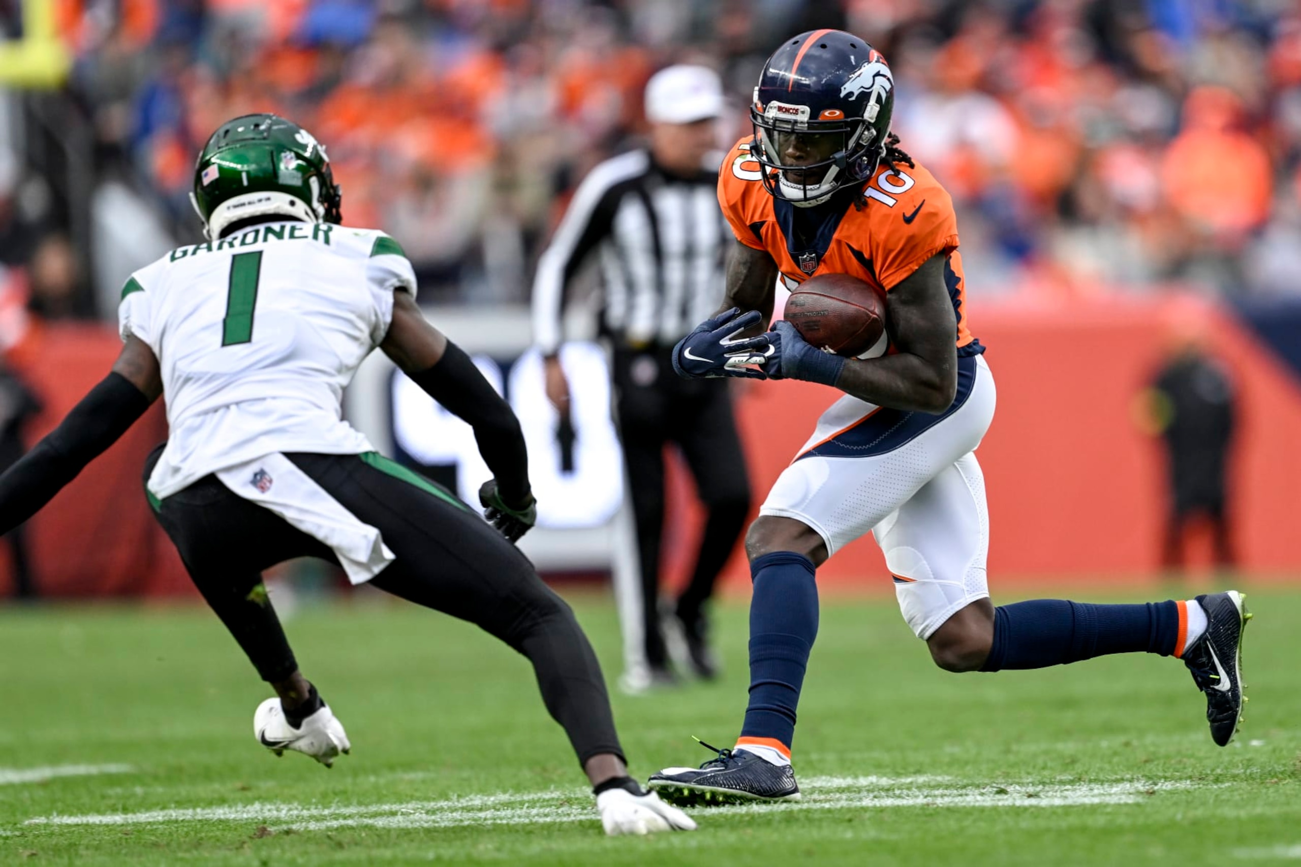 DENVER, CO - OCTOBER 23: Jerry Jeudy (10) of the Denver Broncos runs after making a catch as Sauce Gardner (1) of the New York Jets pursues during the second half of New Yorks 16-9 win at Empower Field at Mile High in Denver on Sunday, October 23, 2022. (Photo by AAron Ontiveroz/MediaNews Group/The Denver Post via Getty Images)