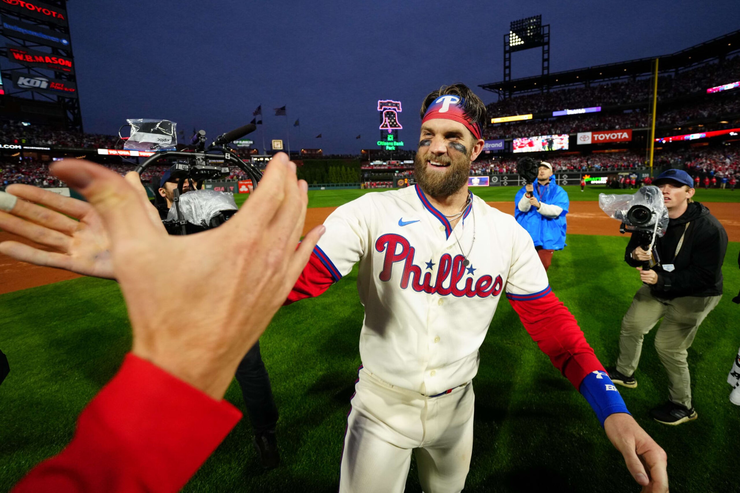 PHILADELPHIA, PA - OCTOBER 23:   Bryce Harper #3 of the Philadelphia Phillies celebrates after taking Game 5 and winning the NLCS against the San Diego Padres at Citizens Bank Park on Sunday, October 23, 2022 in Philadelphia, Pennsylvania. (Photo by Rob Tringali/MLB Photos via Getty Images)