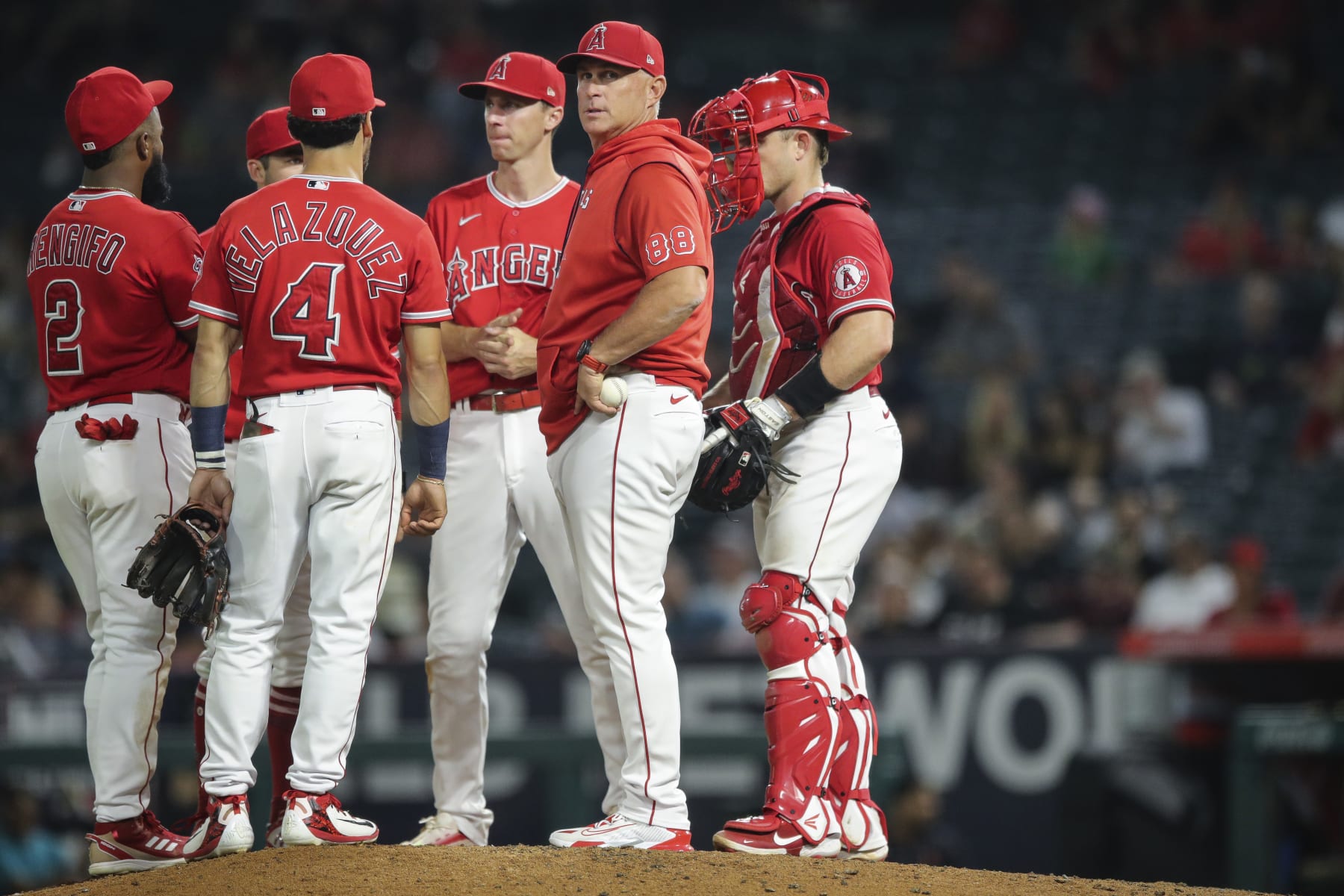 ANAHEIM, CALIFORNIA - SEPTEMBER 06: Los Angeles Angels manager Phil Nevin #88 meets with players on the mound in the eighth inning against the Detroit Tigers at Angel Stadium of Anaheim on September 06, 2022 in Anaheim, California. (Photo by Meg Oliphant/Getty Images)