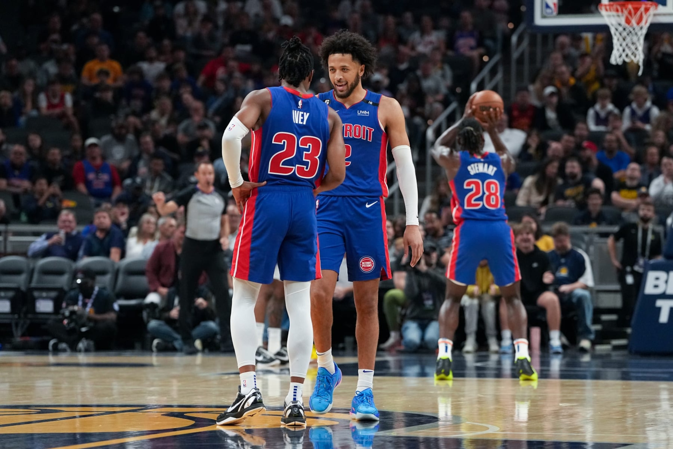 INDIANAPOLIS, INDIANA - OCTOBER 22: Jaden Ivey #23 and Cade Cunningham #2 of the Detroit Pistons meet in the first quarter against the Indiana Pacers at Gainbridge Fieldhouse on October 22, 2022 in Indianapolis, Indiana. NOTE TO USER: User expressly acknowledges and agrees that, by downloading and or using this photograph, User is consenting to the terms and conditions of the Getty Images License Agreement. (Photo by Dylan Buell/Getty Images)