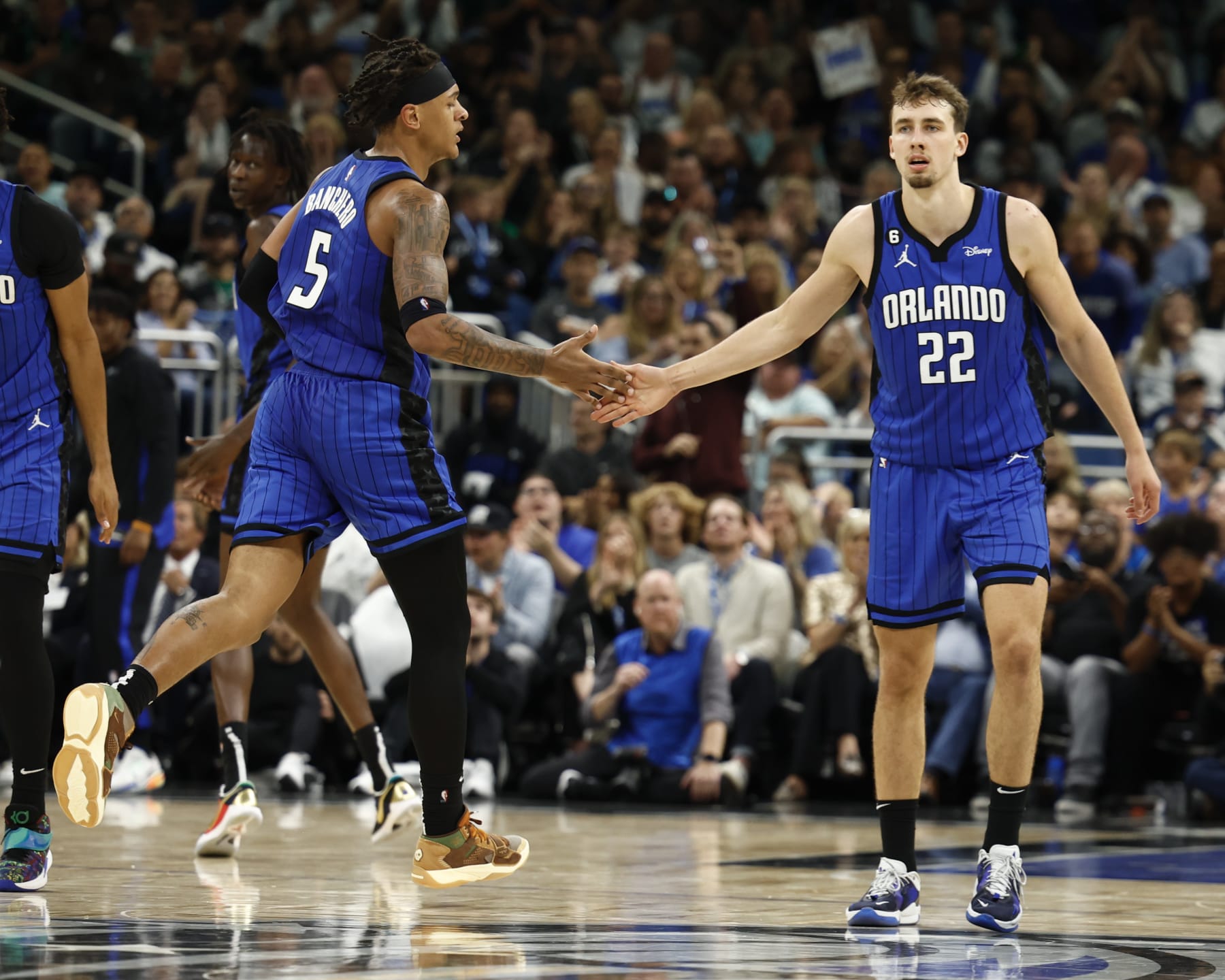 ORLANDO, FLORIDA - OCTOBER 22: Paolo Banchero #5 and Franz Wagner #22 of the Orlando Magic react against the Boston Celtics during the fourth quarter at Amway Center on October 22, 2022 in Orlando, Florida. NOTE TO USER: User expressly acknowledges and agrees that, by downloading and or using this photograph, User is consenting to the terms and conditions of the Getty Images License Agreement. (Photo by Douglas P. DeFelice/Getty Images)