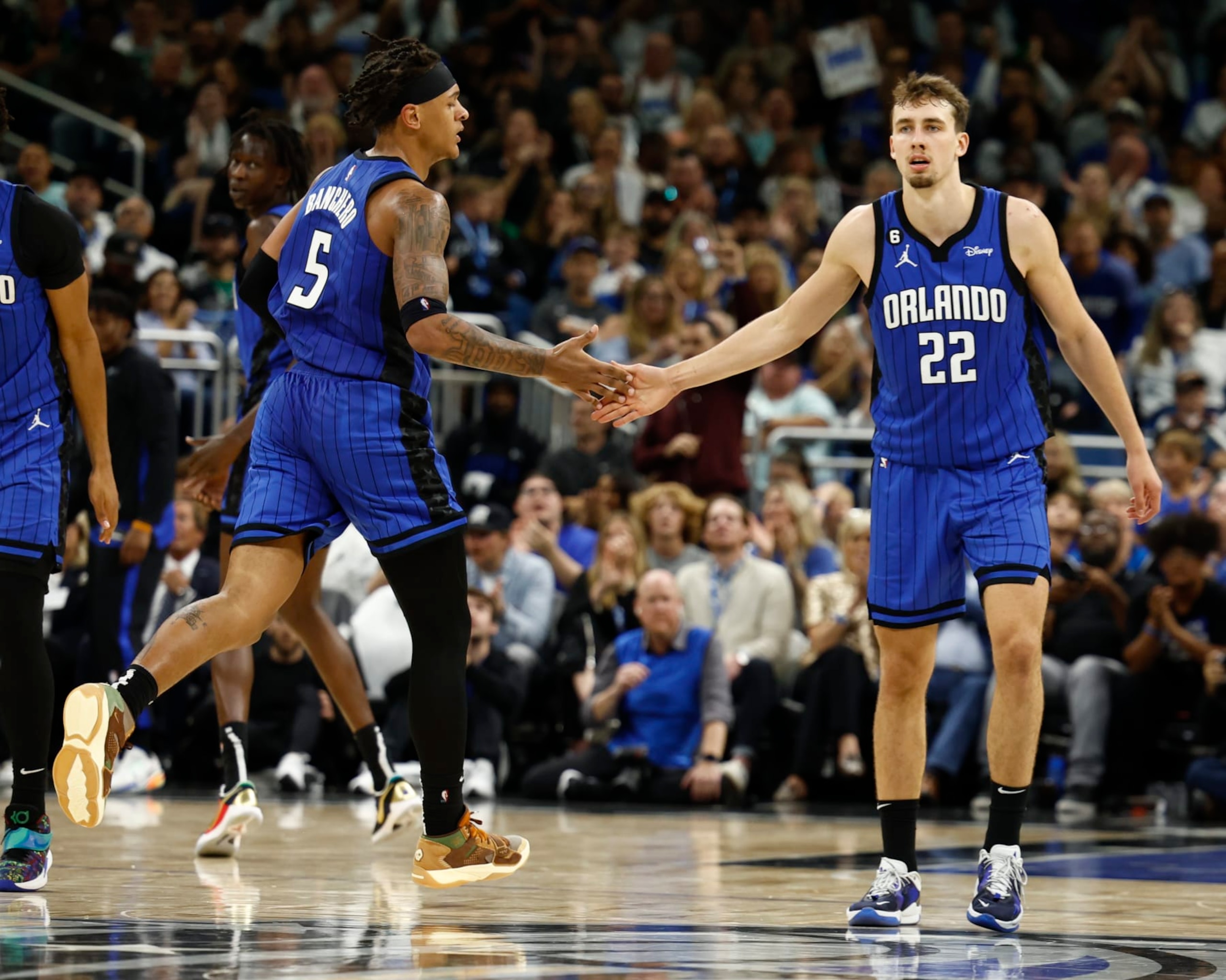 ORLANDO, FLORIDA - OCTOBER 22: Paolo Banchero #5 and Franz Wagner #22 of the Orlando Magic react against the Boston Celtics during the fourth quarter at Amway Center on October 22, 2022 in Orlando, Florida. NOTE TO USER: User expressly acknowledges and agrees that, by downloading and or using this photograph, User is consenting to the terms and conditions of the Getty Images License Agreement. (Photo by Douglas P. DeFelice/Getty Images)