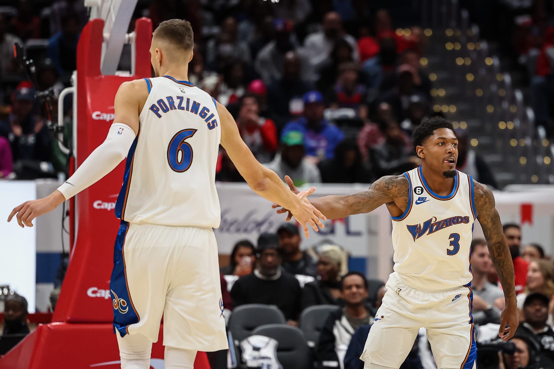 WASHINGTON, DC - OCTOBER 21: Kristaps Porzingis #6 and Bradley Beal #3 of the Washington Wizards celebrate after a play against the Chicago Bulls during the first half at Capital One Arena on October 21, 2022 in Washington, DC. NOTE TO USER: User expressly acknowledges and agrees that, by downloading and or using this photograph, User is consenting to the terms and conditions of the Getty Images License Agreement. (Photo by Scott Taetsch/Getty Images)