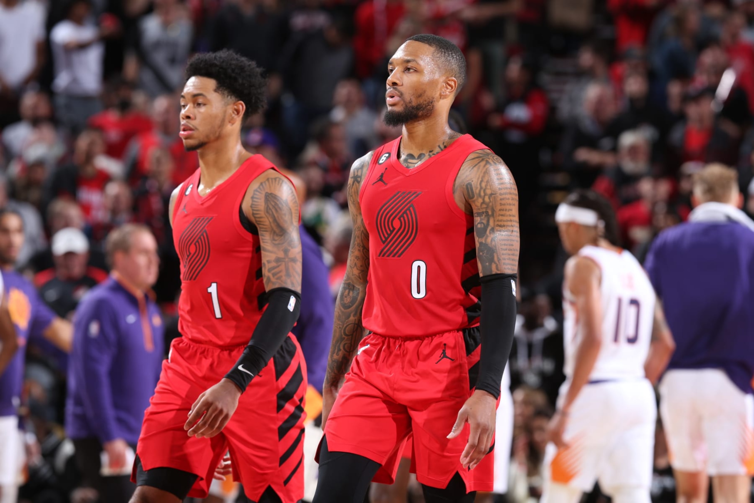 PORTLAND, OR - OCTOBER 21: Anfernee Simons #1 and Damian Lillard #0 of the Portland Trail Blazers walks on to the court during the game against the Phoenix Suns on October 21, 2022 at the Moda Center Arena in Portland, Oregon. NOTE TO USER: User expressly acknowledges and agrees that, by downloading and or using this photograph, user is consenting to the terms and conditions of the Getty Images License Agreement. Mandatory Copyright Notice: Copyright 2022 NBAE (Photo by Sam Forencich/NBAE via Getty Images)